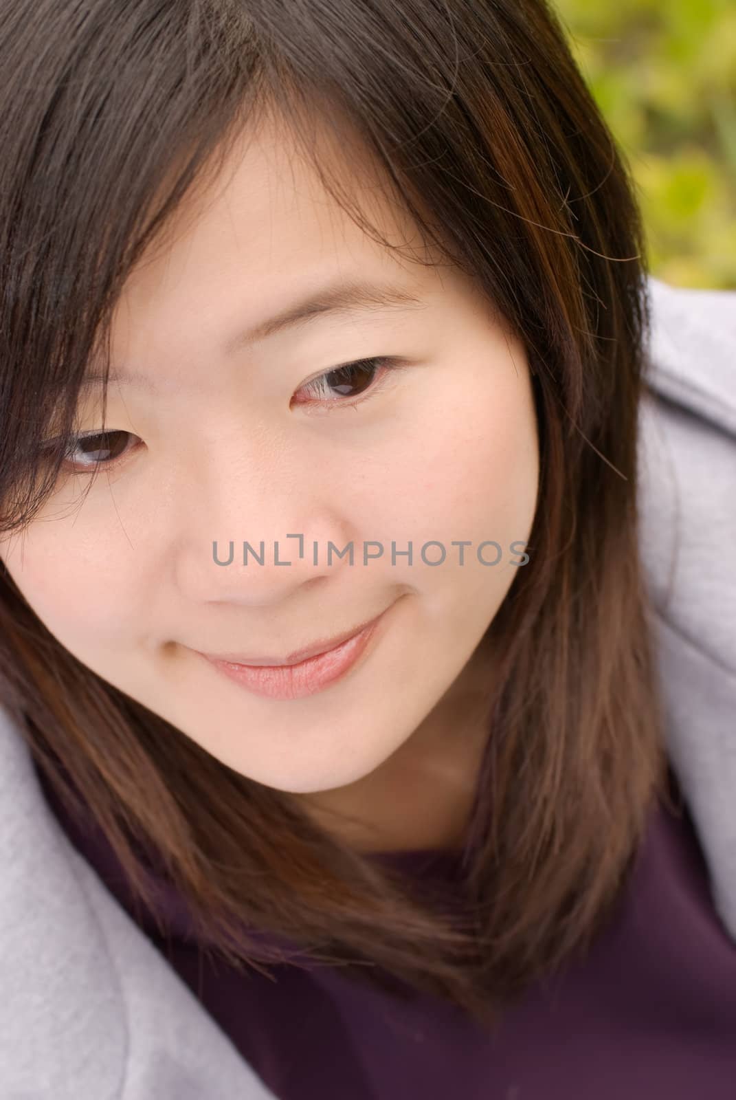 Portrait of Asian woman sit in outdoor.