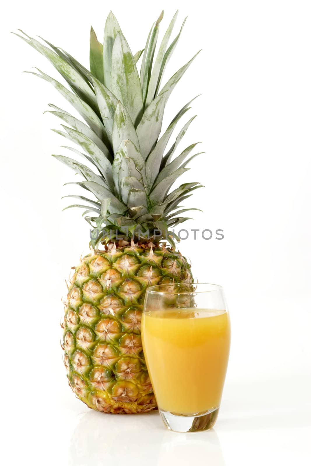 Pineapple with juice on bright background