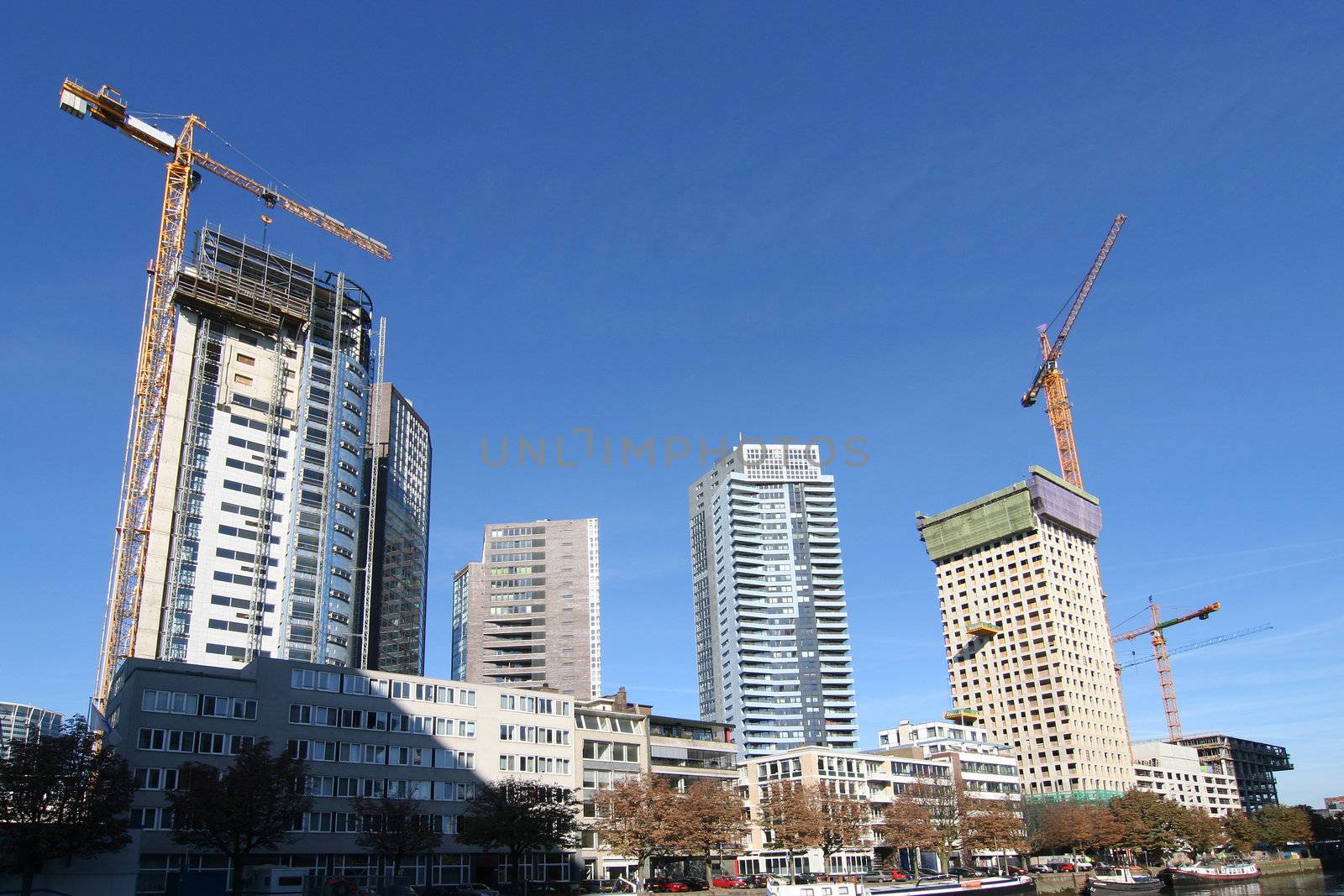New apartment buildings being constructed along the river in Rotterdam