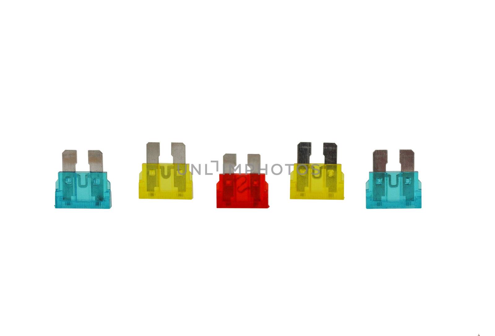 5 electrical car fuses or breakers red, yellow and blue isolated on a white background.
