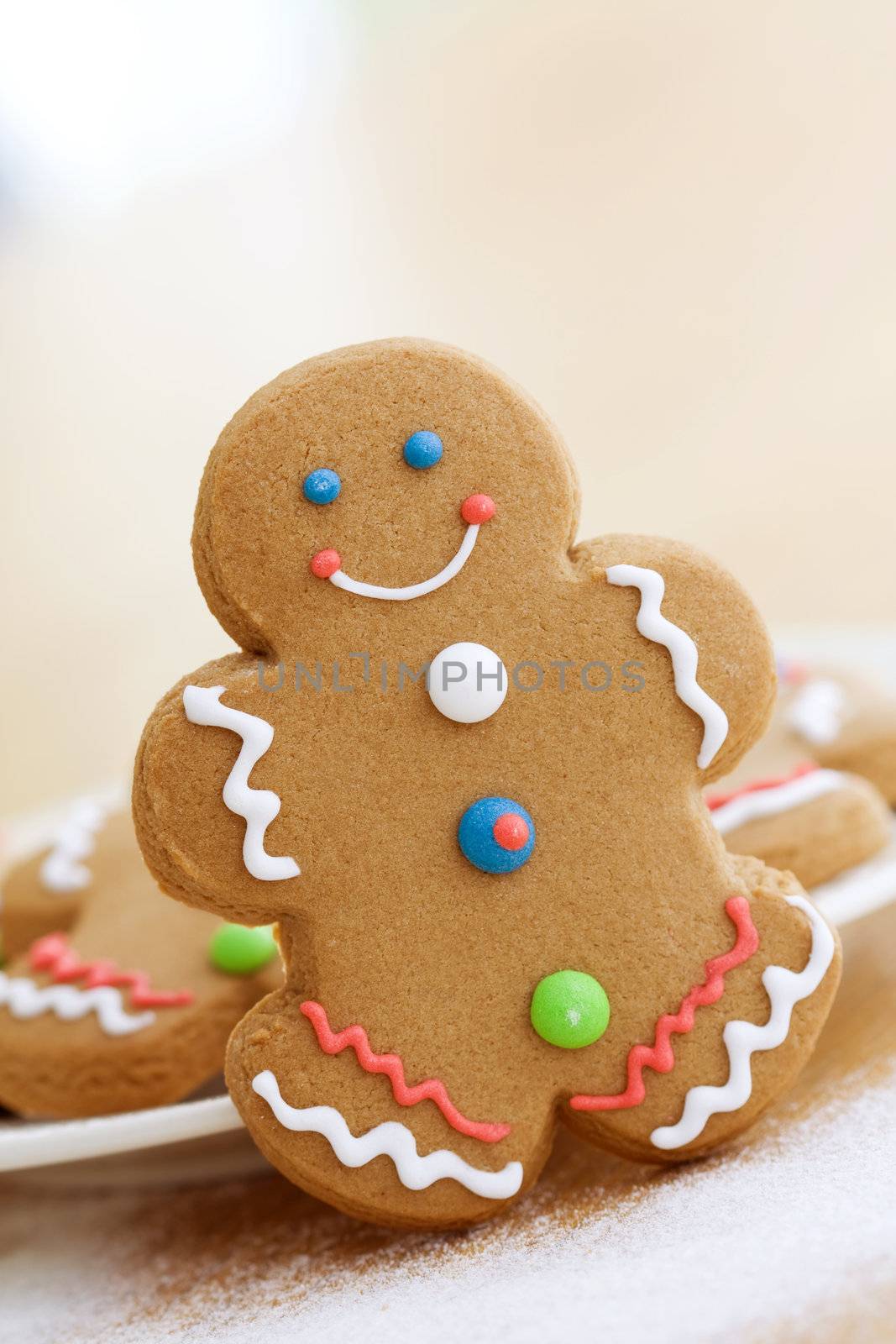 Smiling gingerbread man with brightly colored buttons