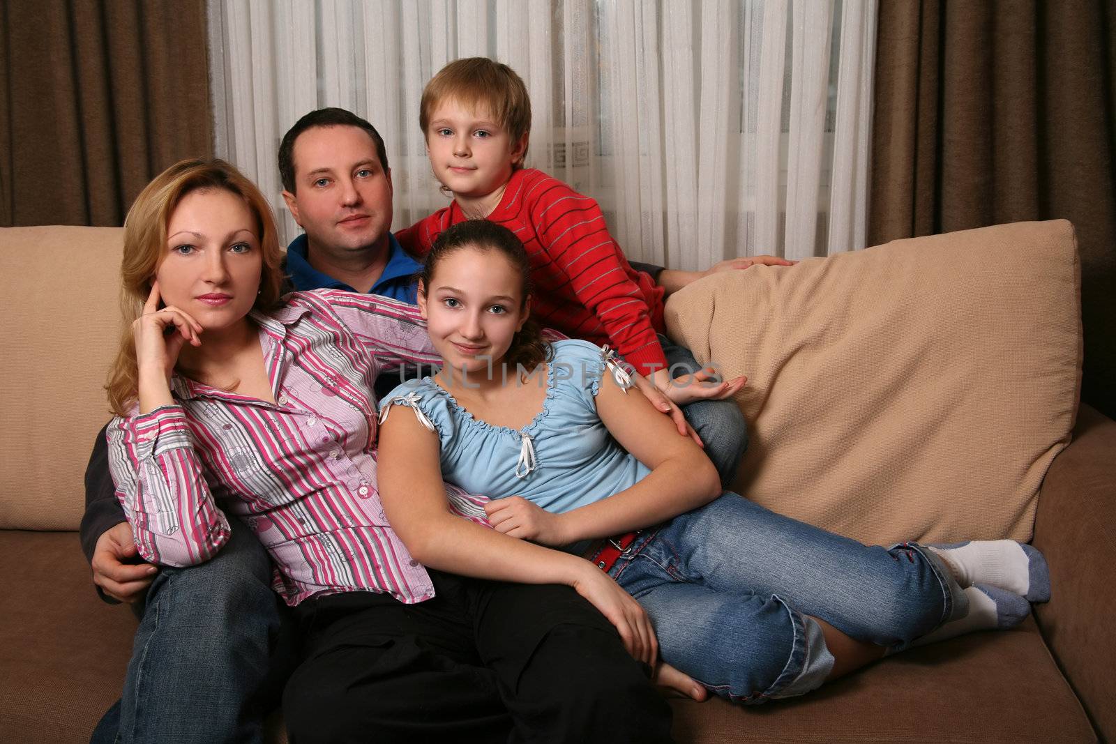 Portrait of parents and children at home