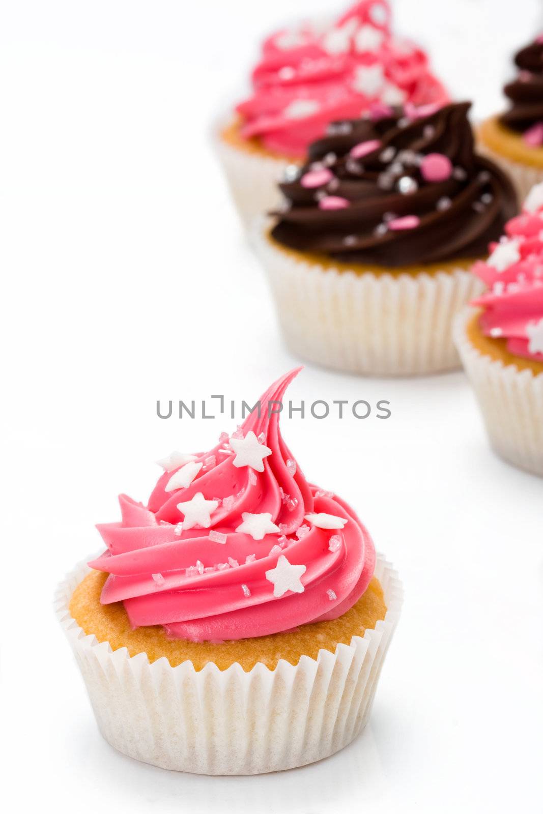 Assortment of cupcakes against a white background