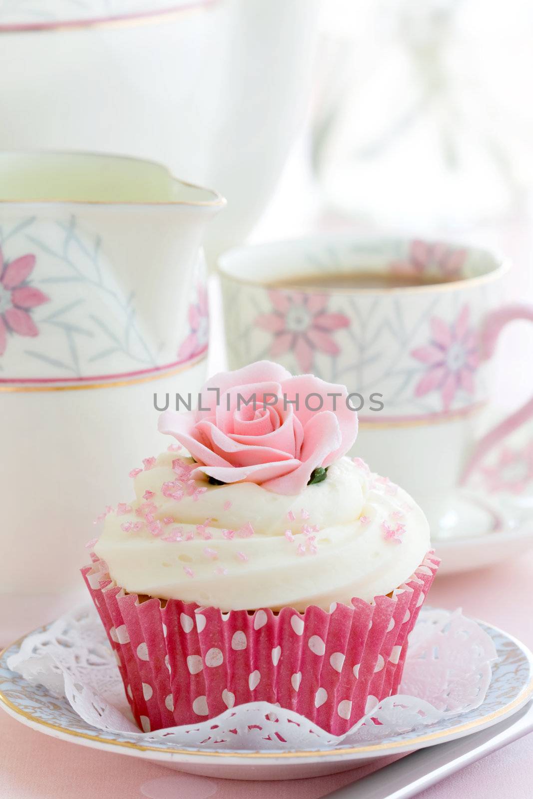 Rose cupcake on a china plate