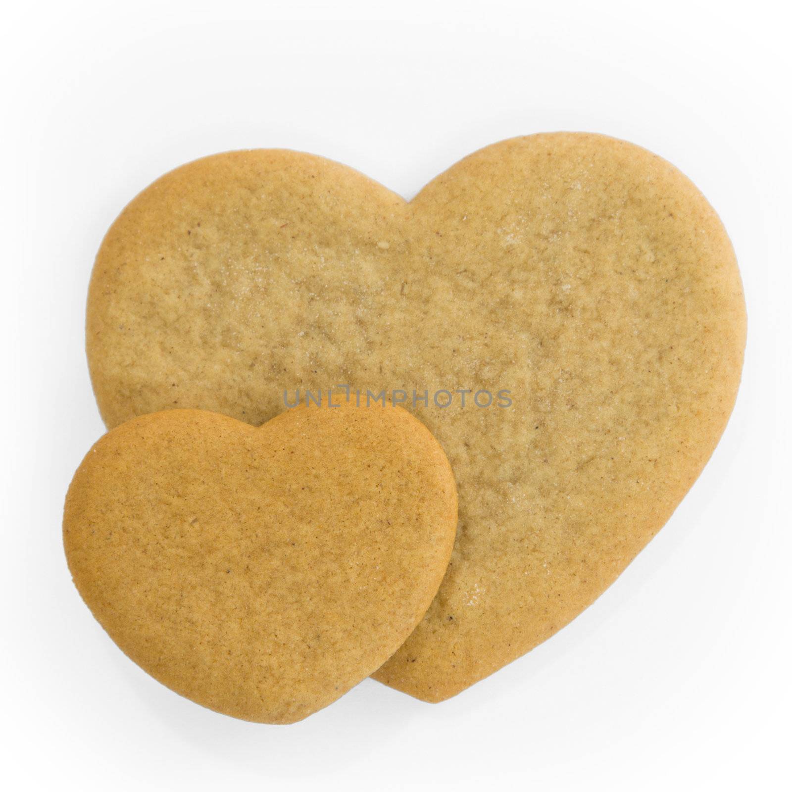 Two blank gingerbread hearts, awaiting decoration