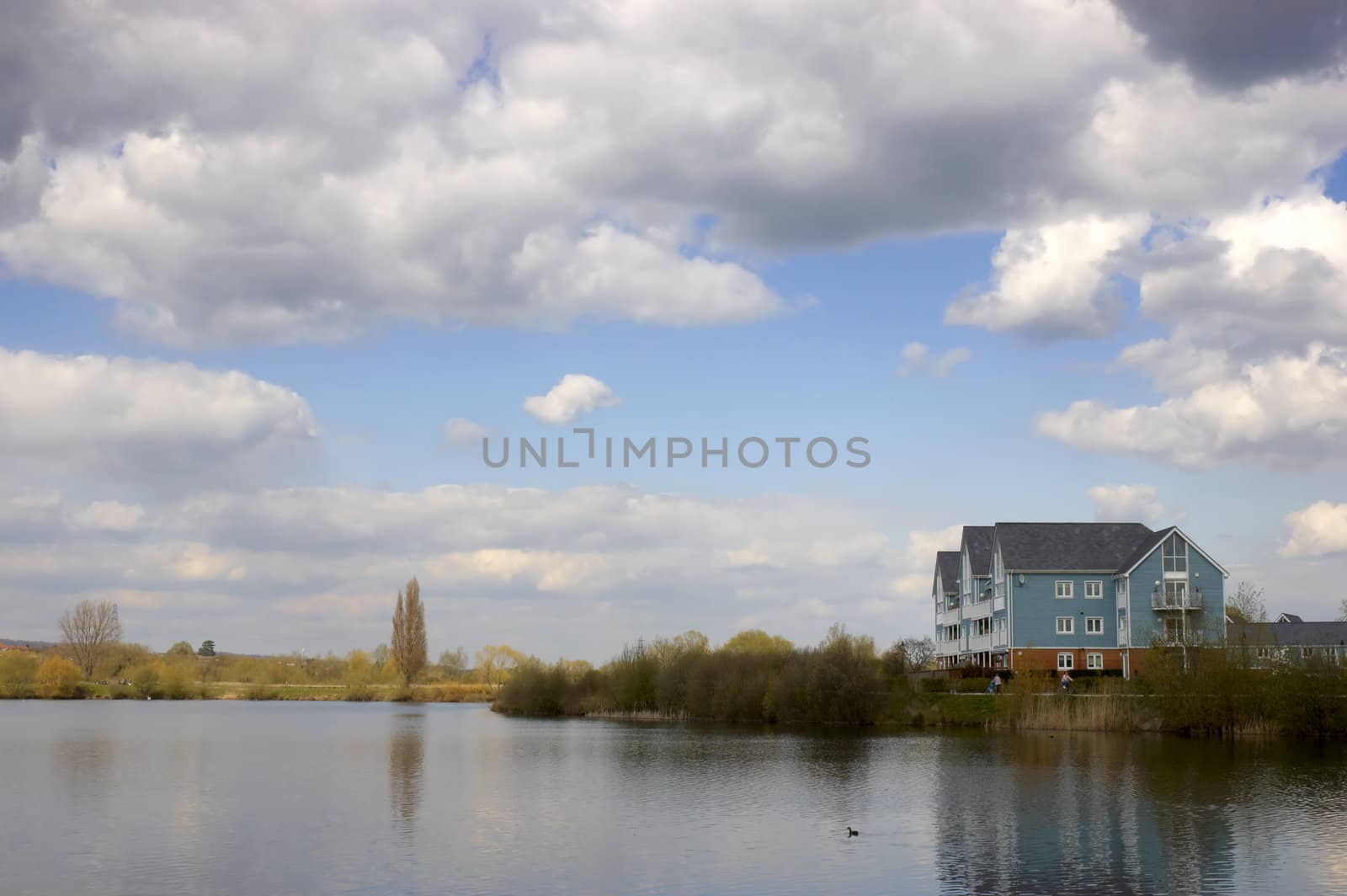 A lake with some wooden clad homes