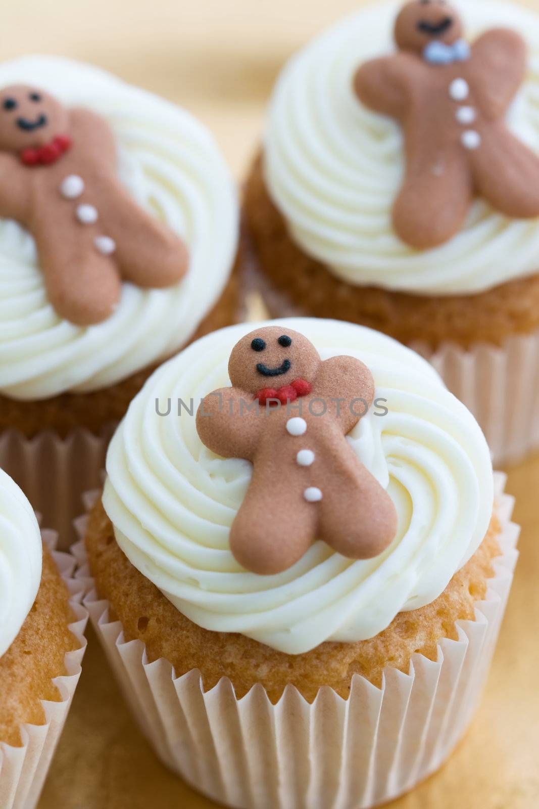 Mini cupcakes decorated with tiny gingerbread men