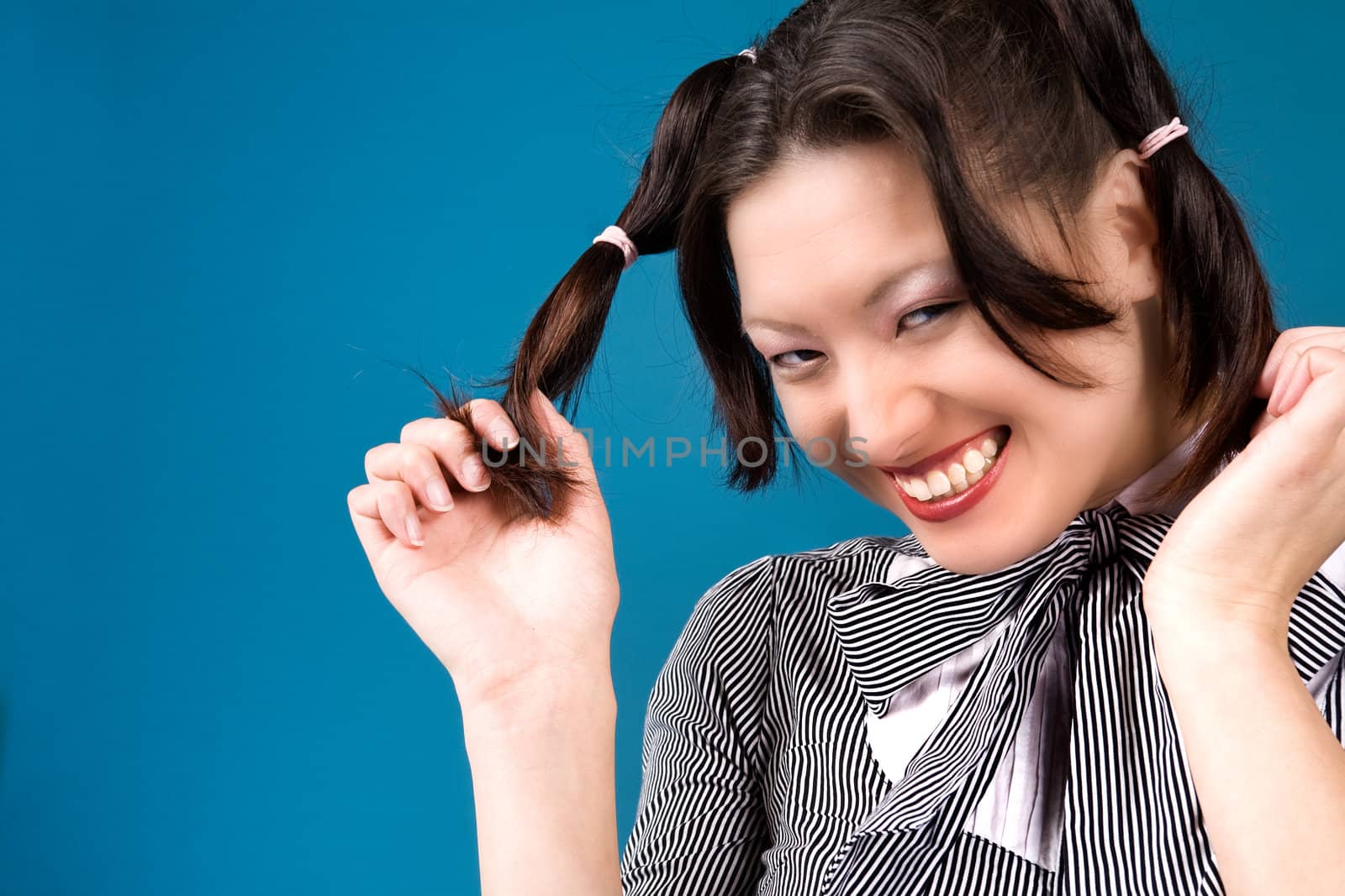 Young girl is happy with her two ponytails