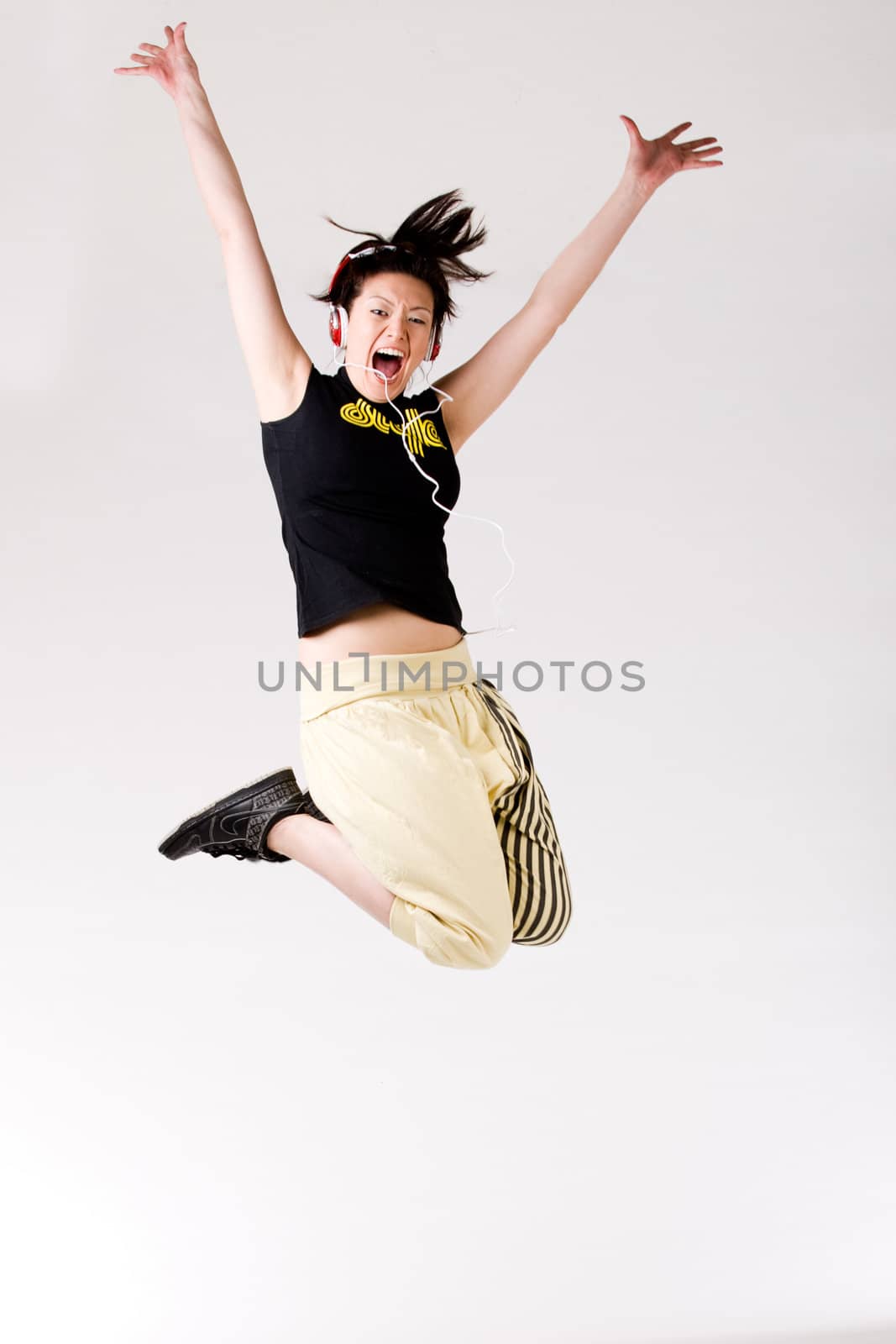 Young girl enjoying the music and dance on it