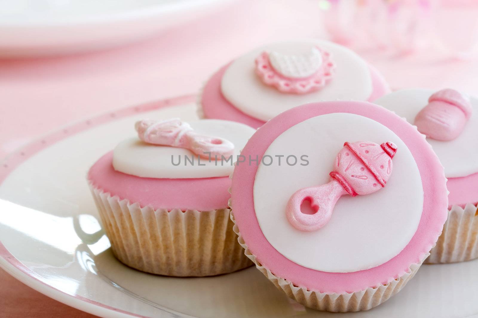 Cupcakes decorated with a baby girl theme