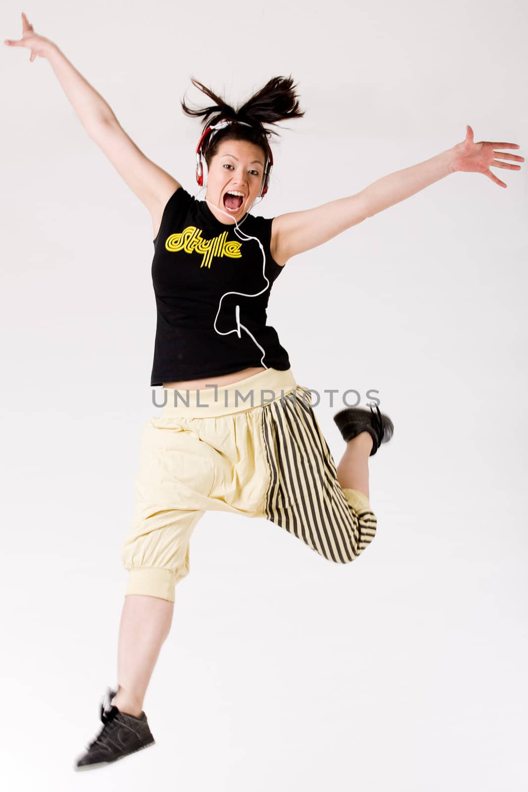Young girl enjoying the music and dance on it