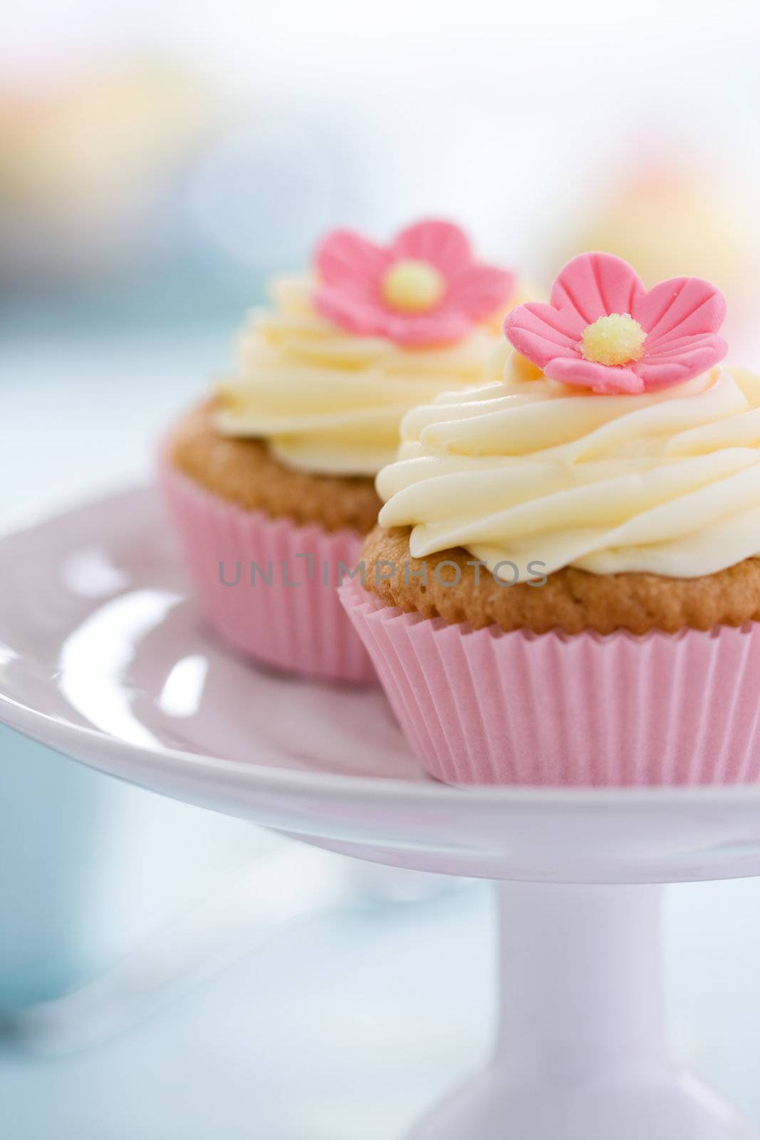 Pink flower cupcakes on a cake stand