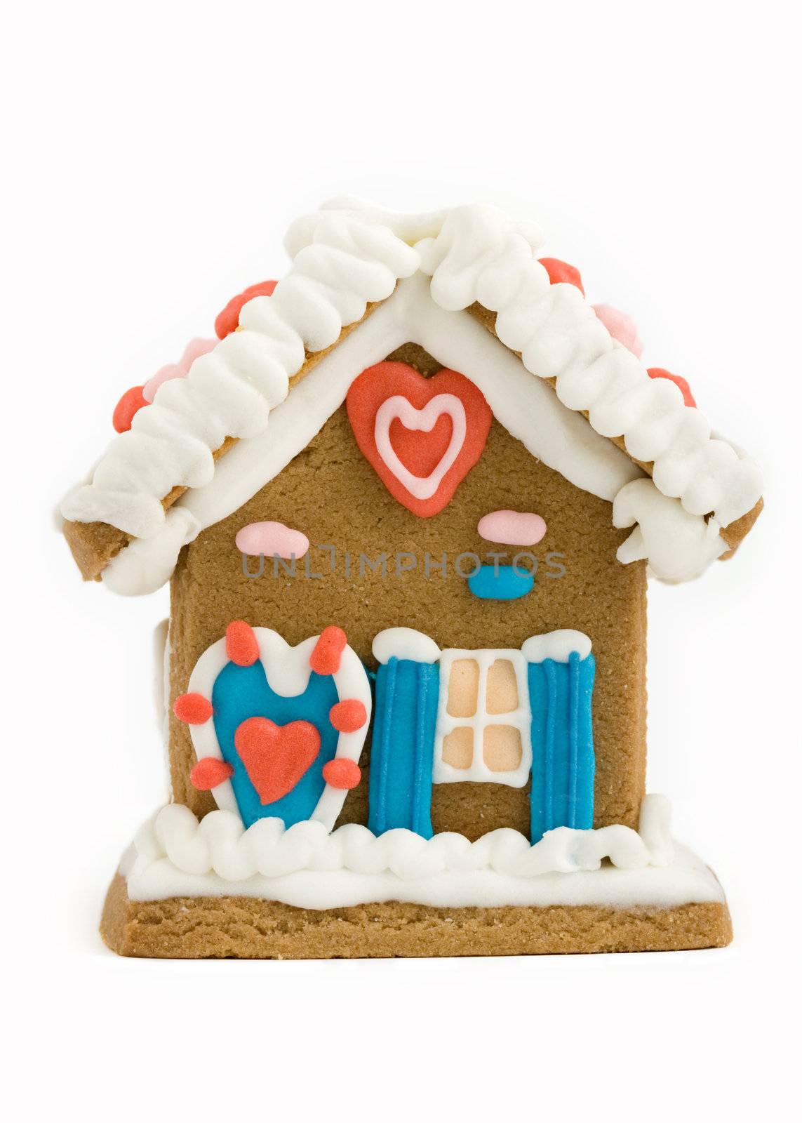 Mini gingerbread house isolated against white