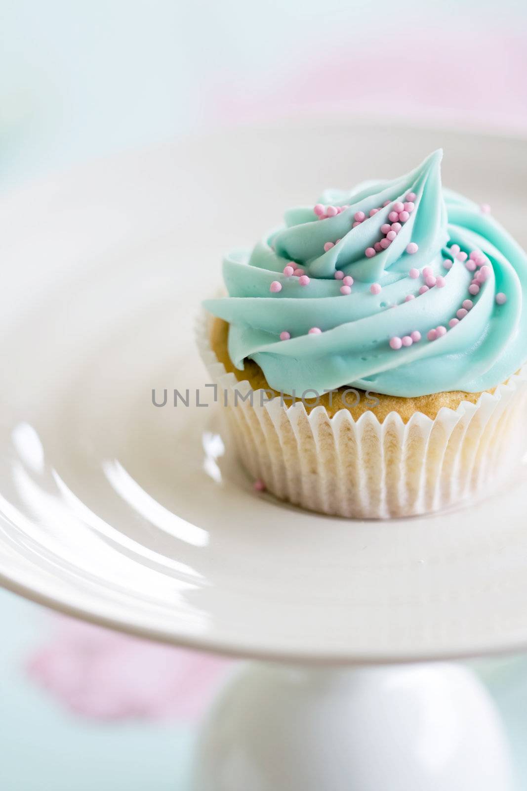 Cupcake decorated with pink sugar sprinkles