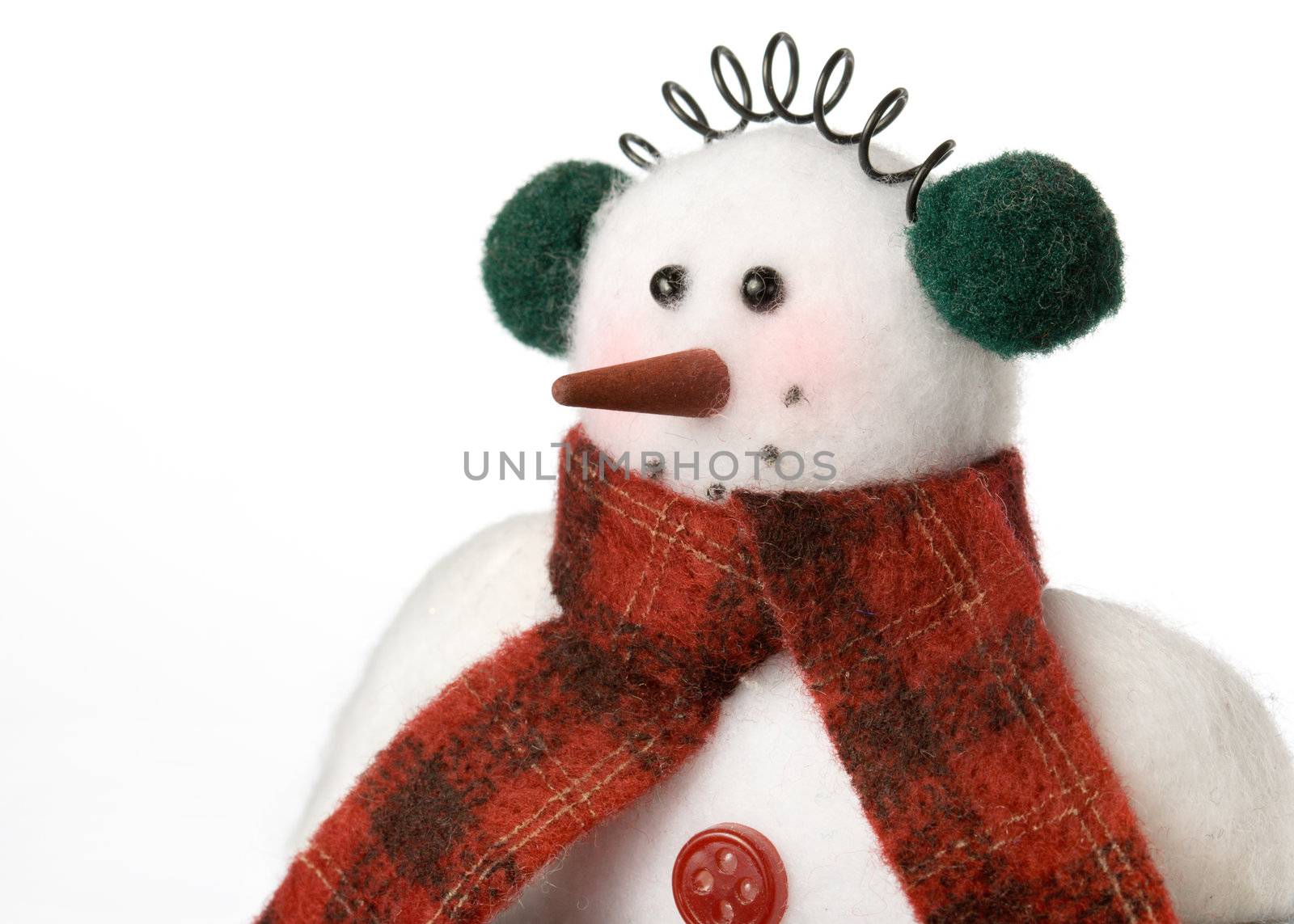 Cheerful snowman soft toy with copy space to side