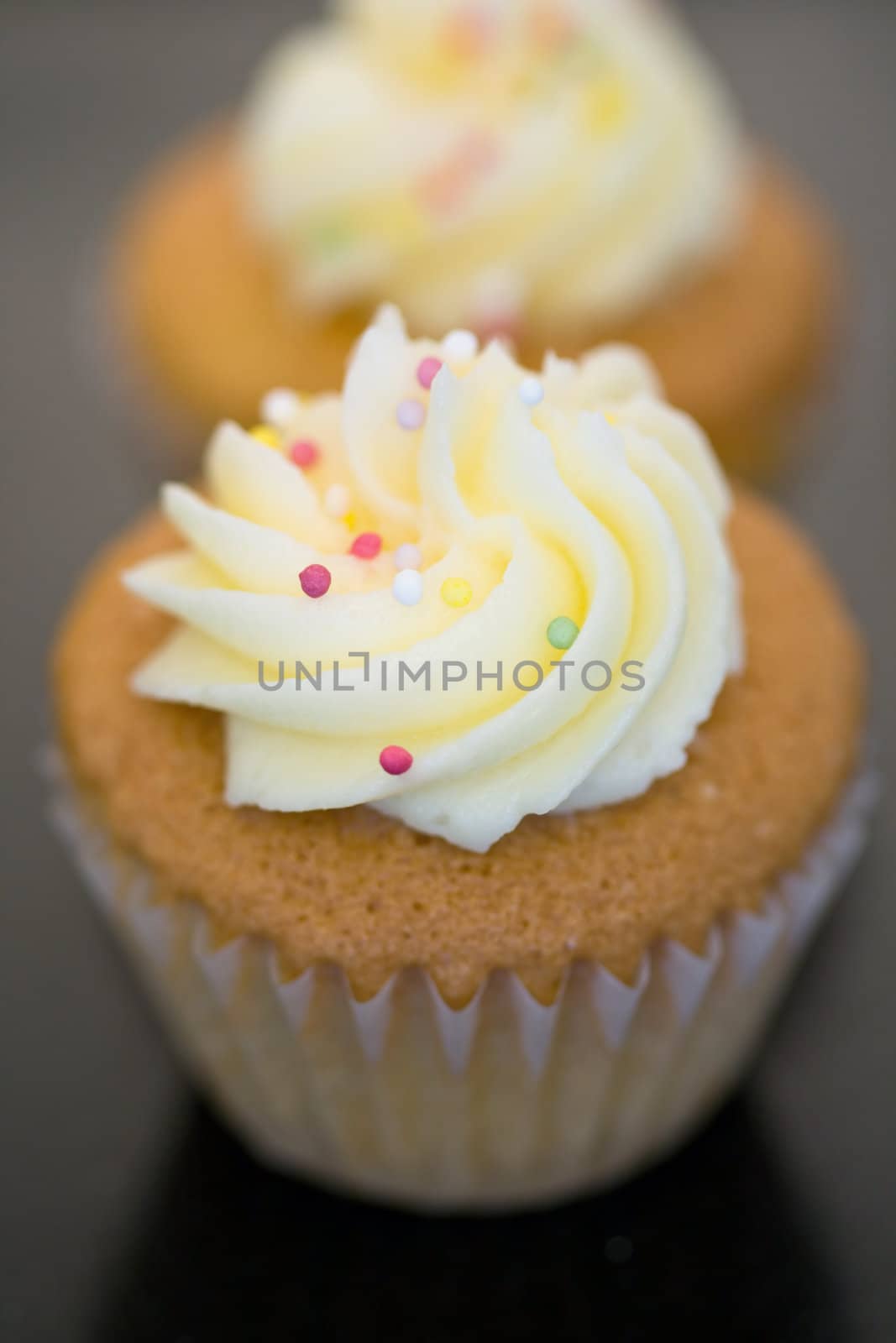 Two cupcakes, shallow depth of field with focus at front