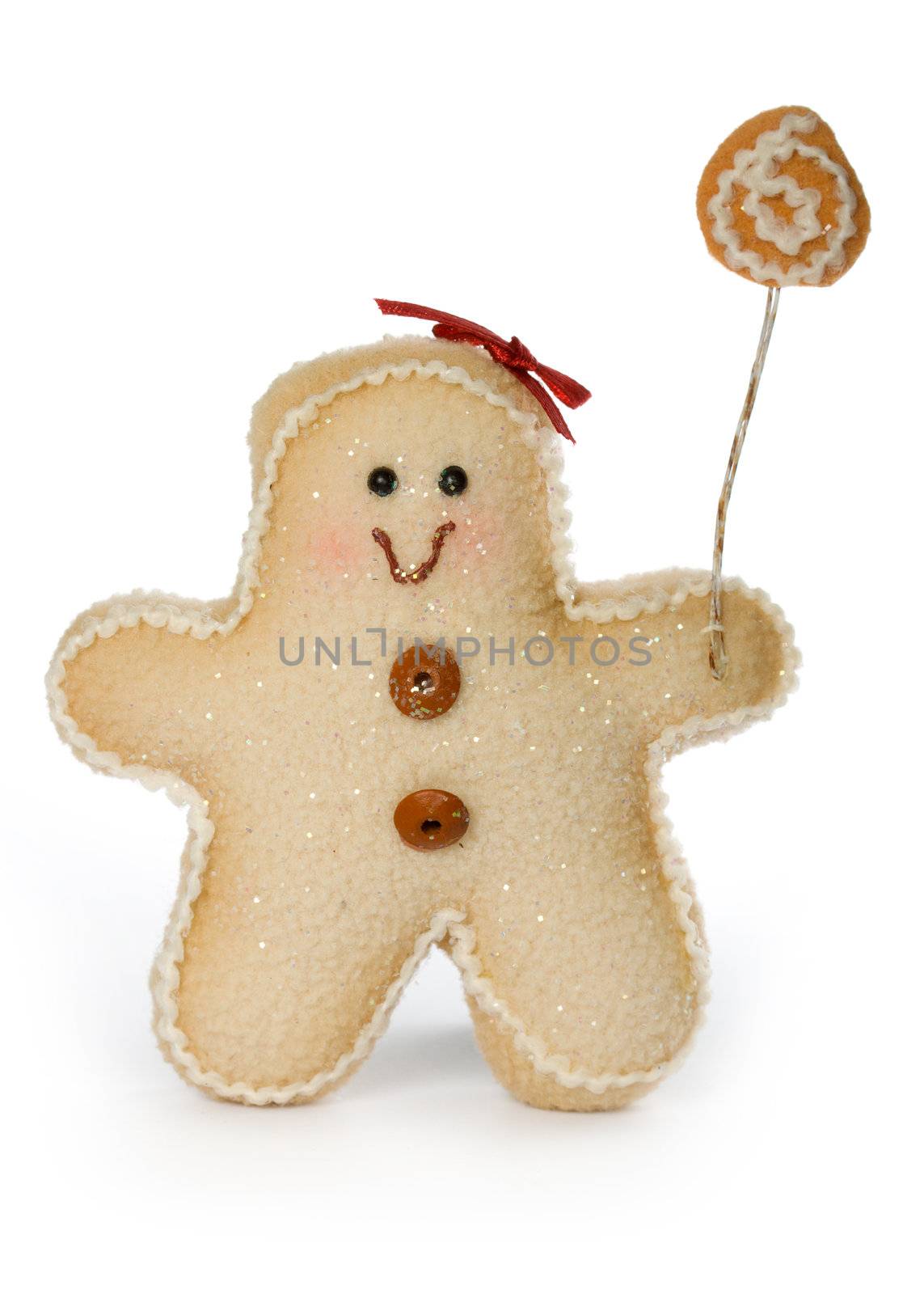 Smiling gingerbread man toy decorated with buttons and bow