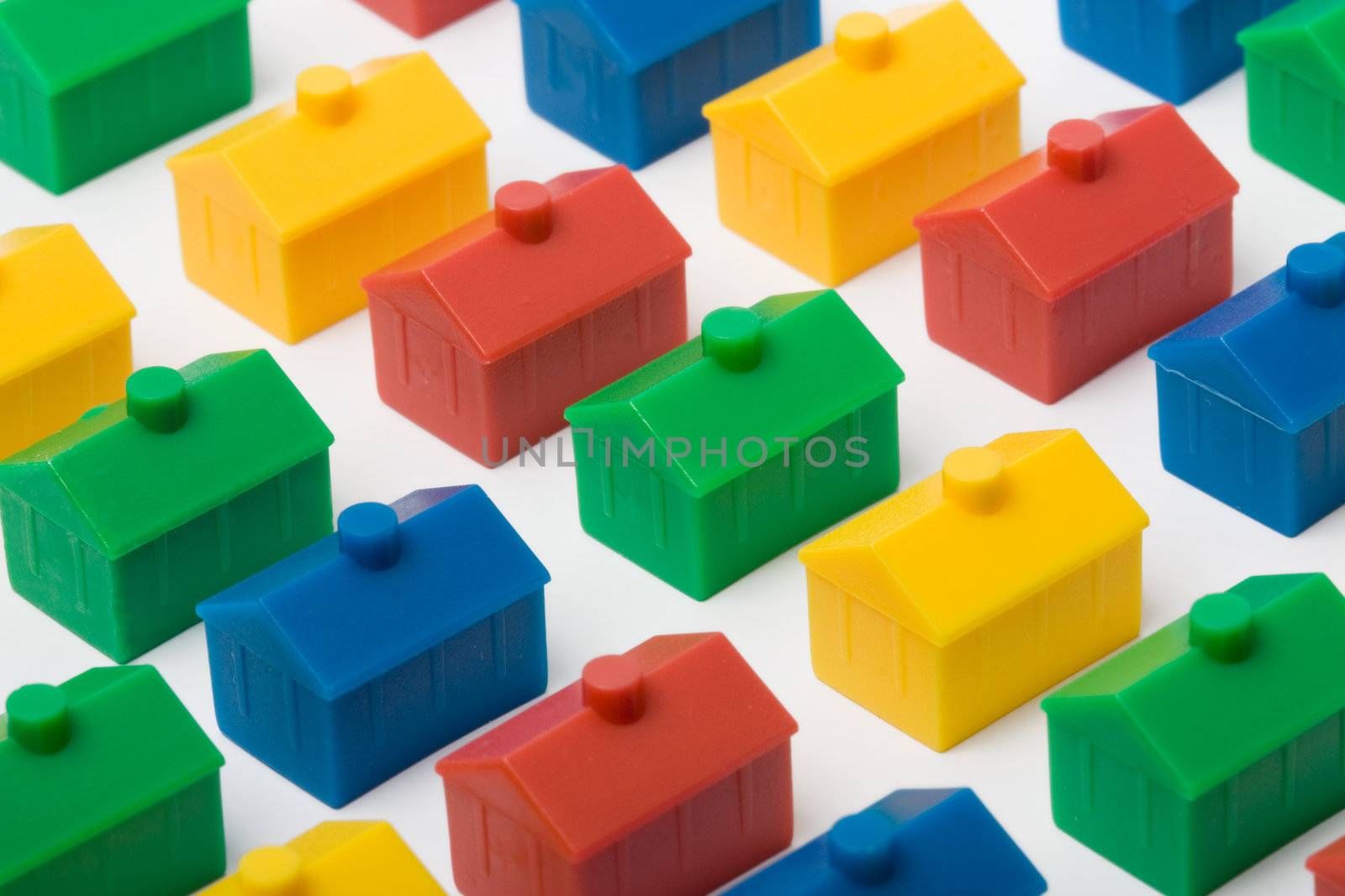Colorful model houses set against a white background