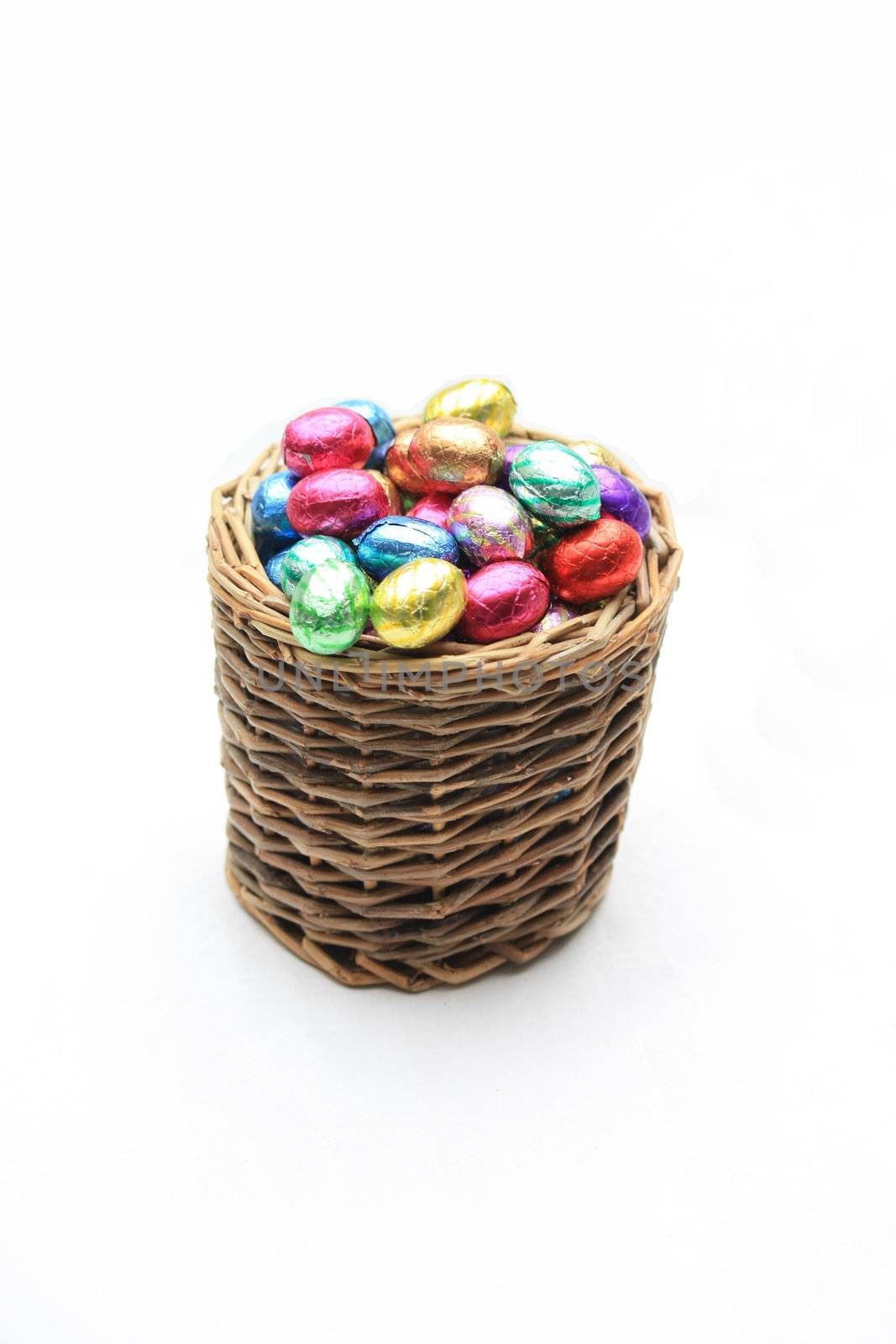 A wicker basket with chocolate easter eggs