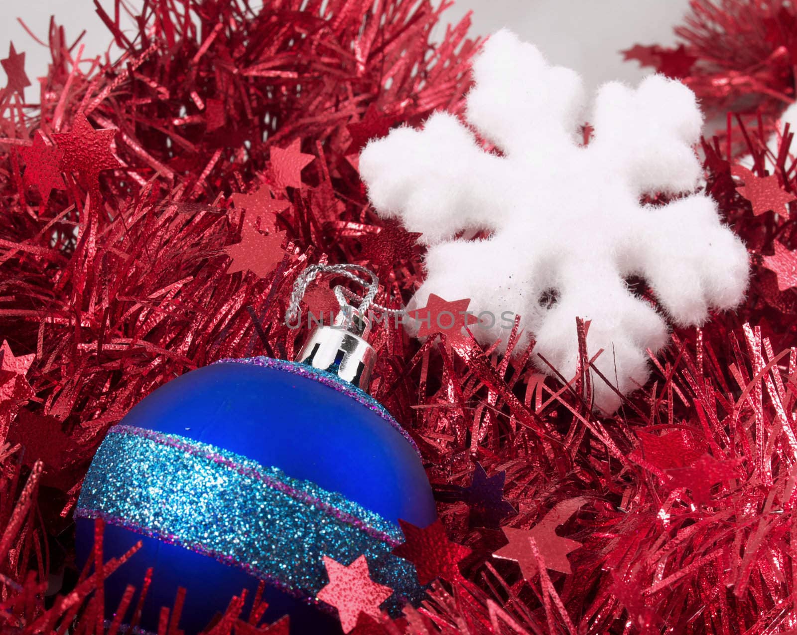 Christmas ball and snowflake on red tinsel by K_Kot