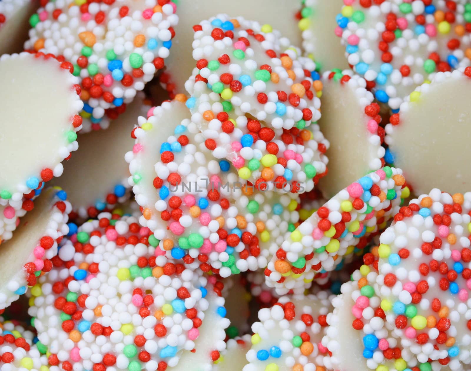 white chocolate drops covered with sprinkles
