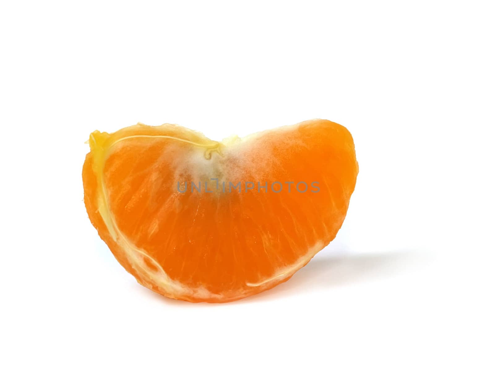 Isolated lobules of tangerine with clipping path. Shadow is not included with the clipping path.