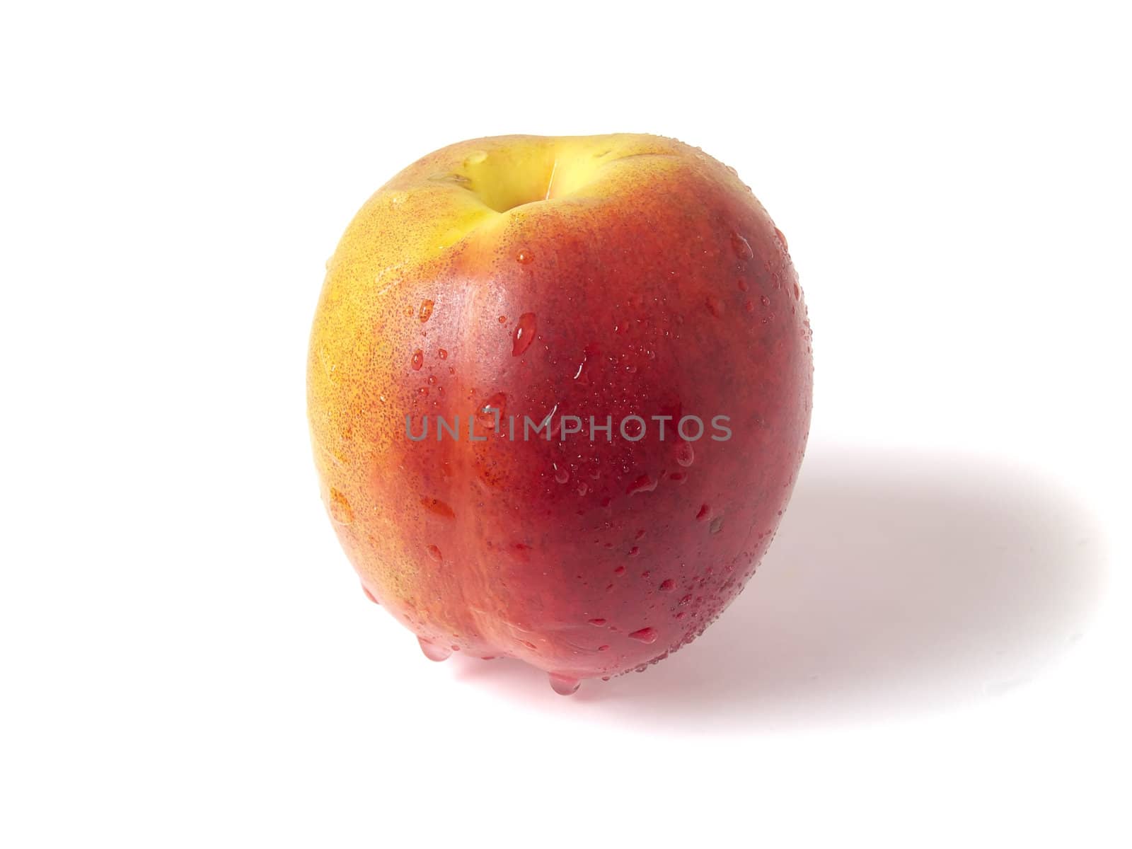 Tasty juicy nectarine with water droplets on a white background whith clipping mask. Shadows is not included in clipping mask