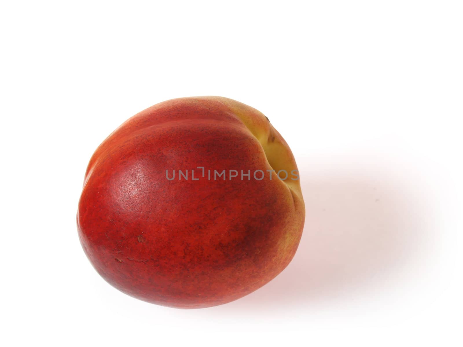 Tasty juicy nectarine on a white background with clipping mask. Shadows is not included in clipping mask