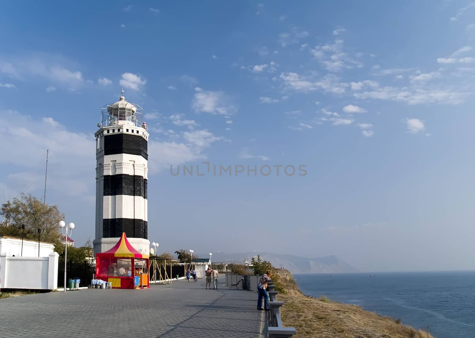 Peaceful beautiful place. Old Lighthouse in the coast of Black sea. Russia