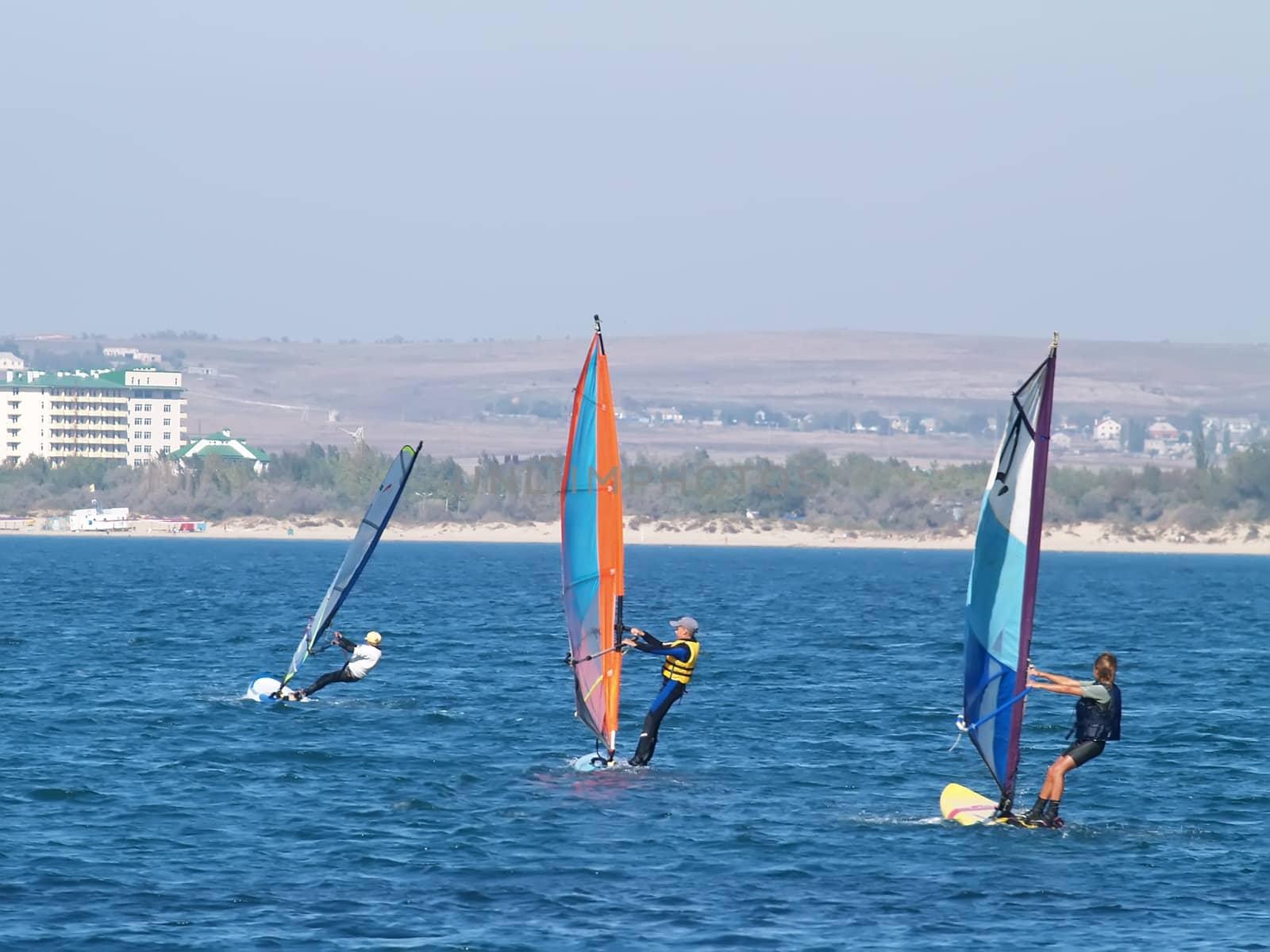 Sailing on calm blue water. Sailboat (yacht) cruising the ocean