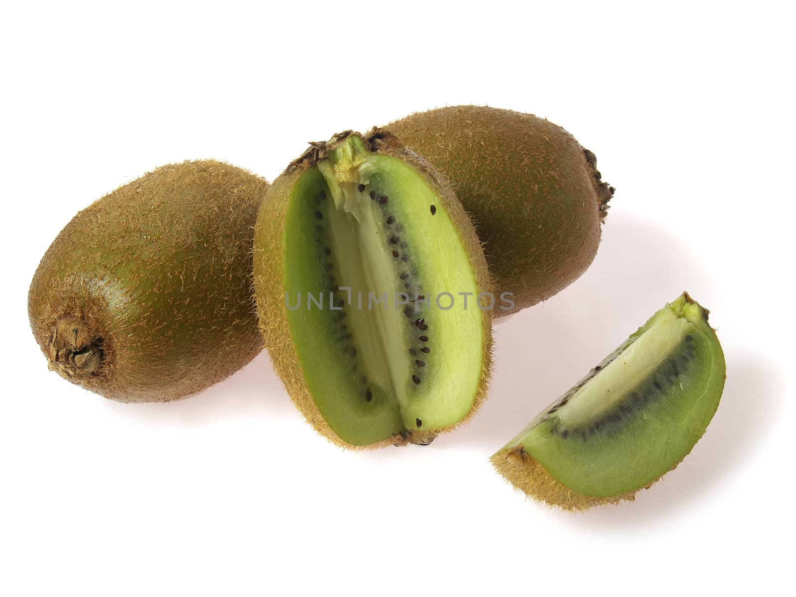 kiwi fruits and pieces, isolated on white