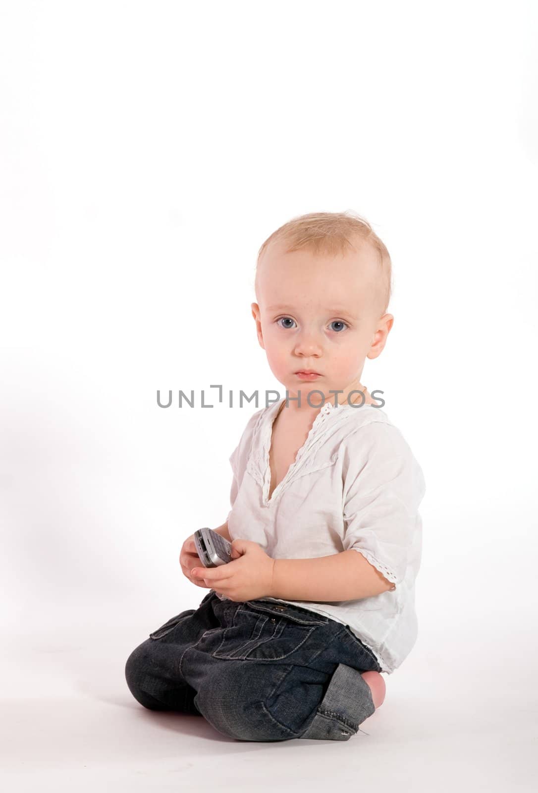 Sad baby with phone isolated on white