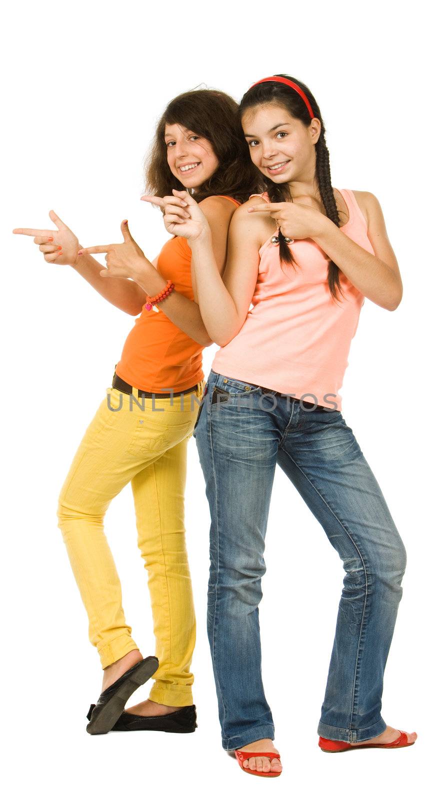 Two joyful teenagers girls isolated on white background