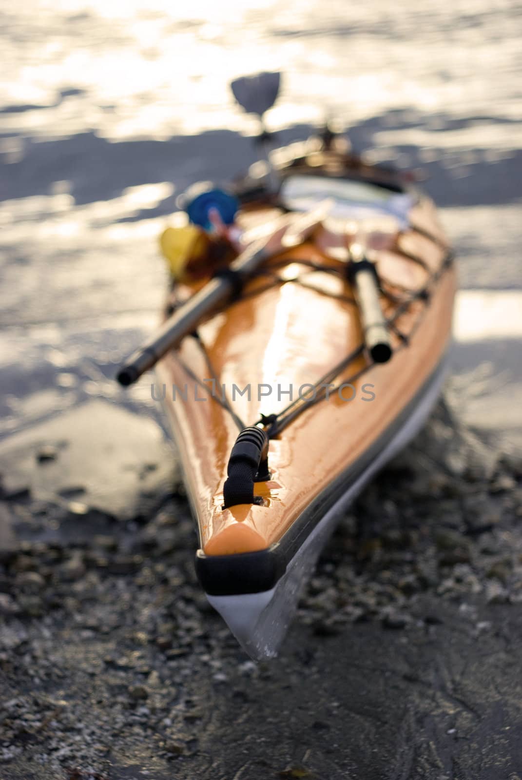 a kayak on the sun set on the water