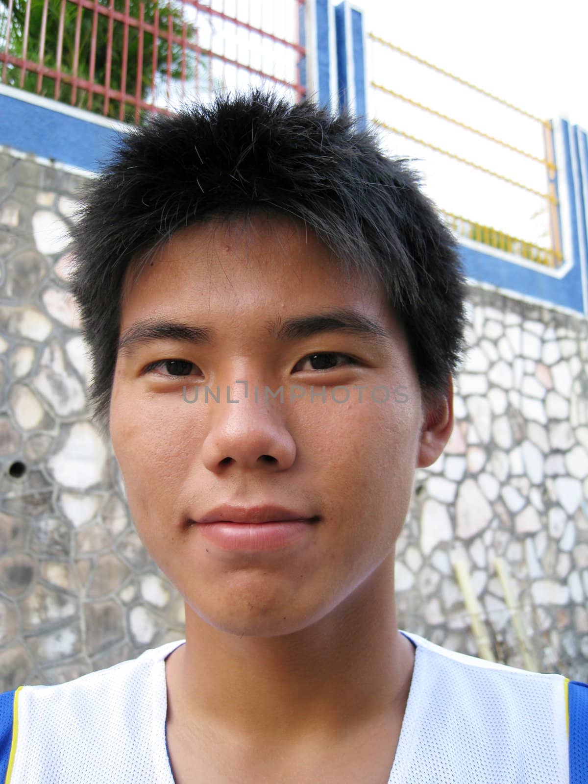 a portraits of a smiling Asian boy
