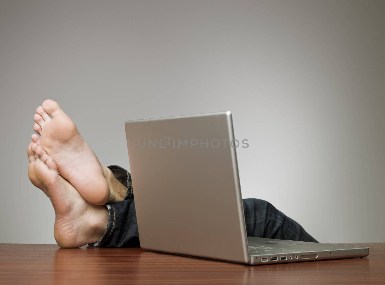 Lazy man in an office with a computer