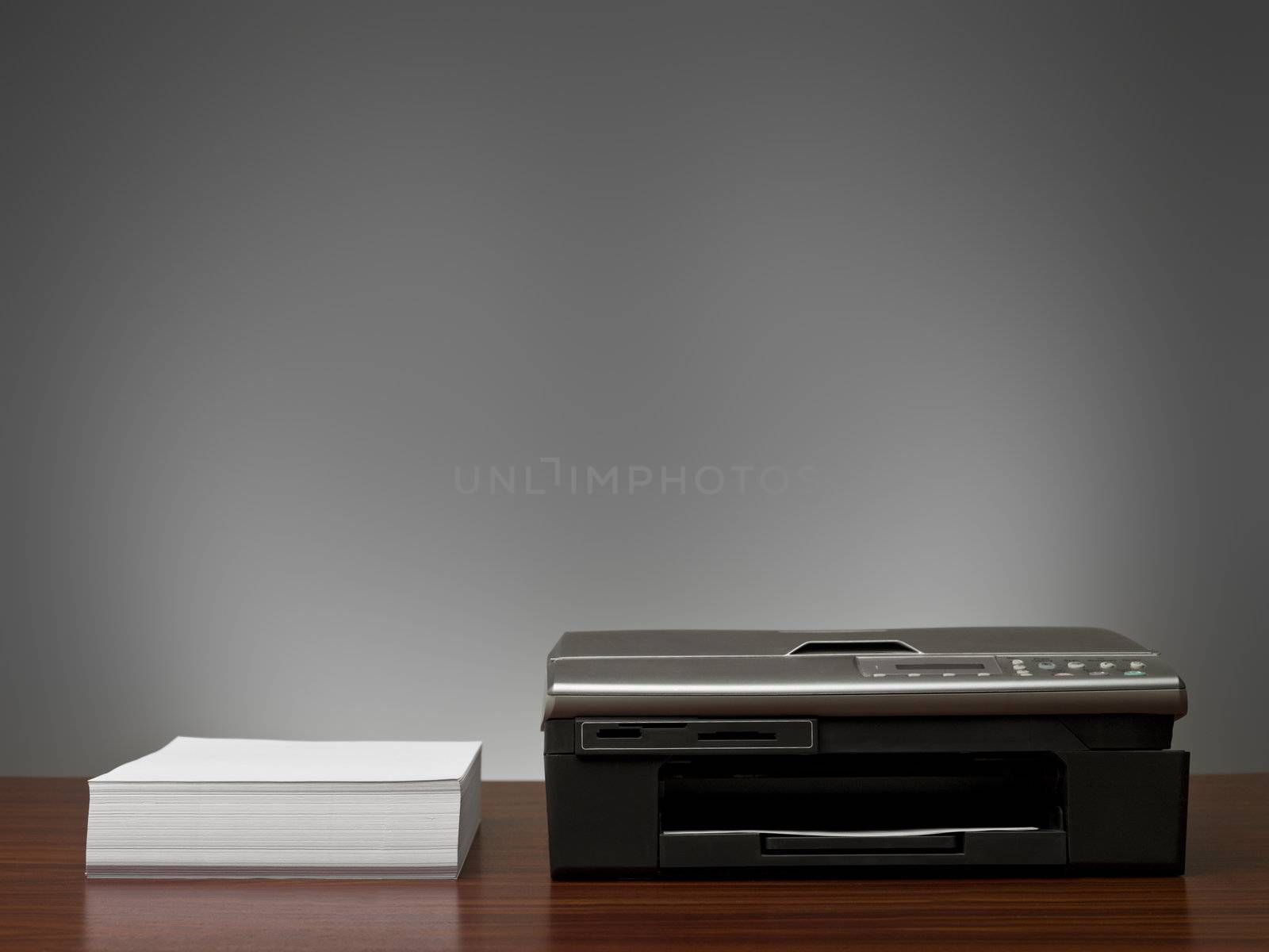 Copy Machine and a stack of  papers by gemenacom