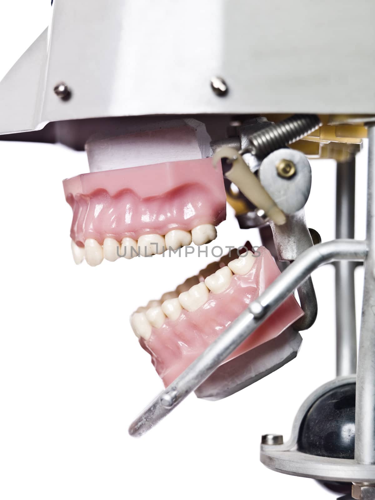 Vintage artificial teeths in a machine