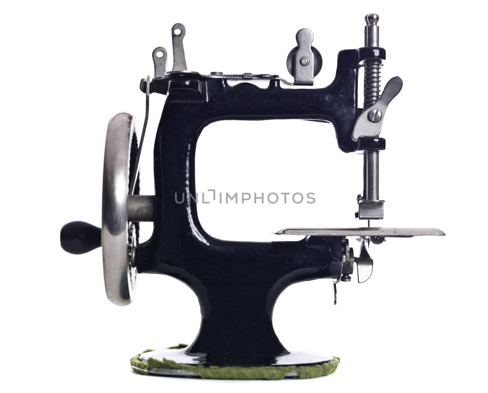 Old sewing machine isolated on white background