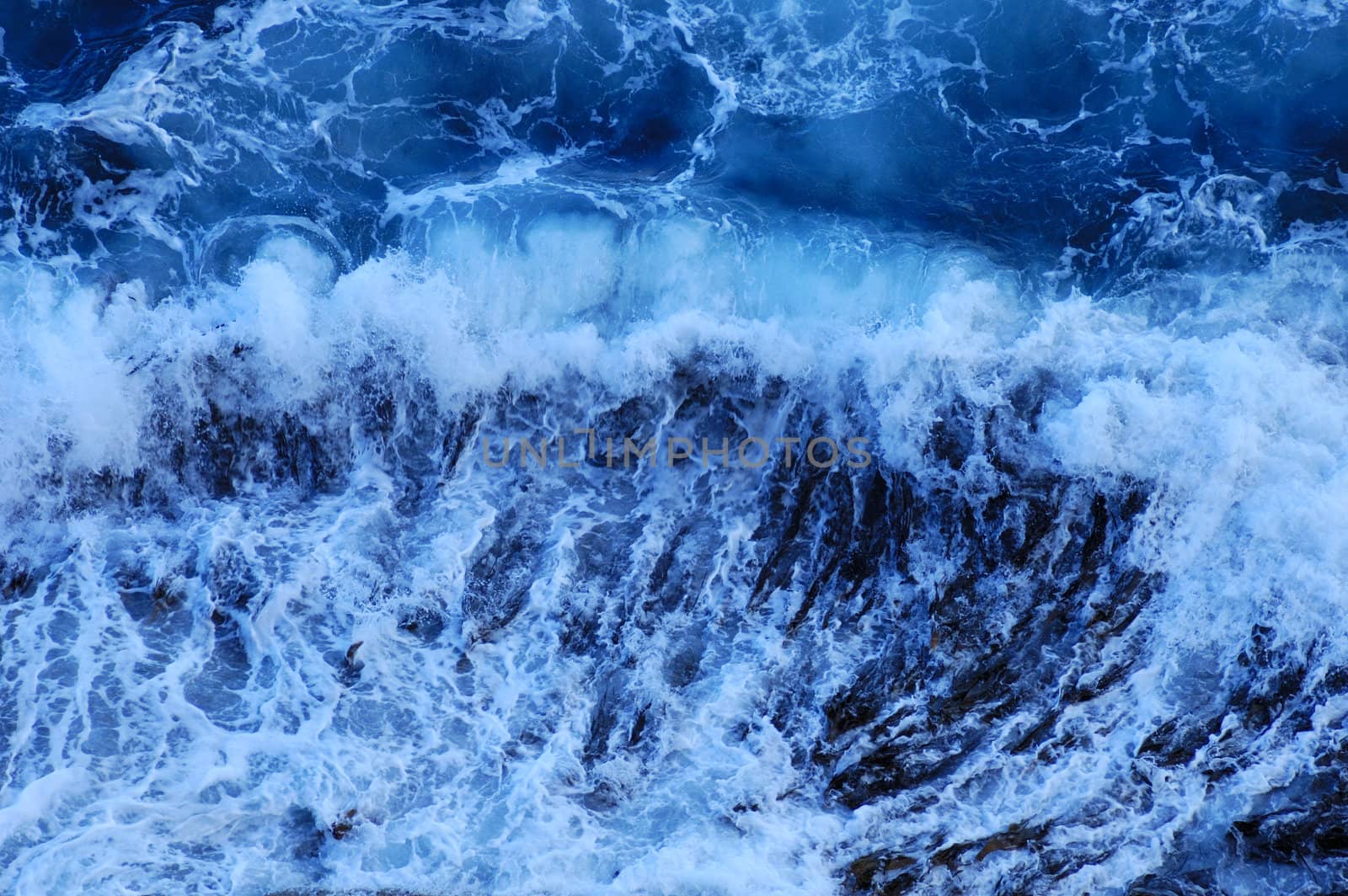 Close up of the foam of a breaking wave, suitable as a graphic background.