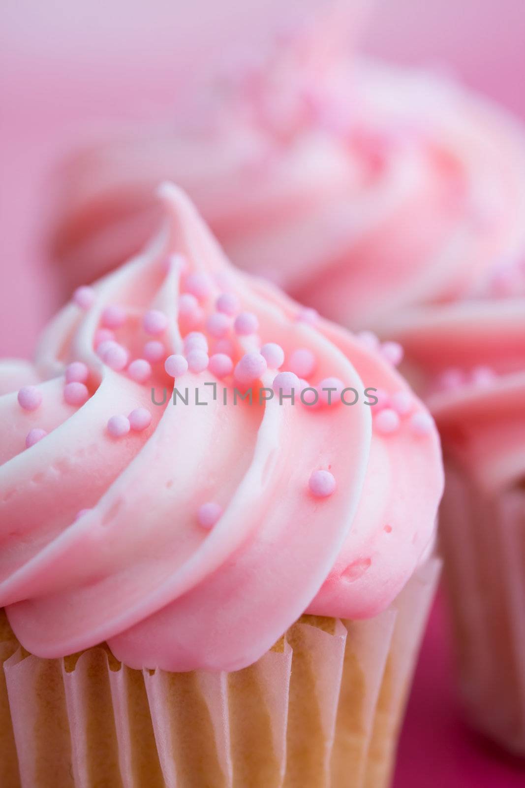 Closeup of pink cupcakes, very shallow depth of field