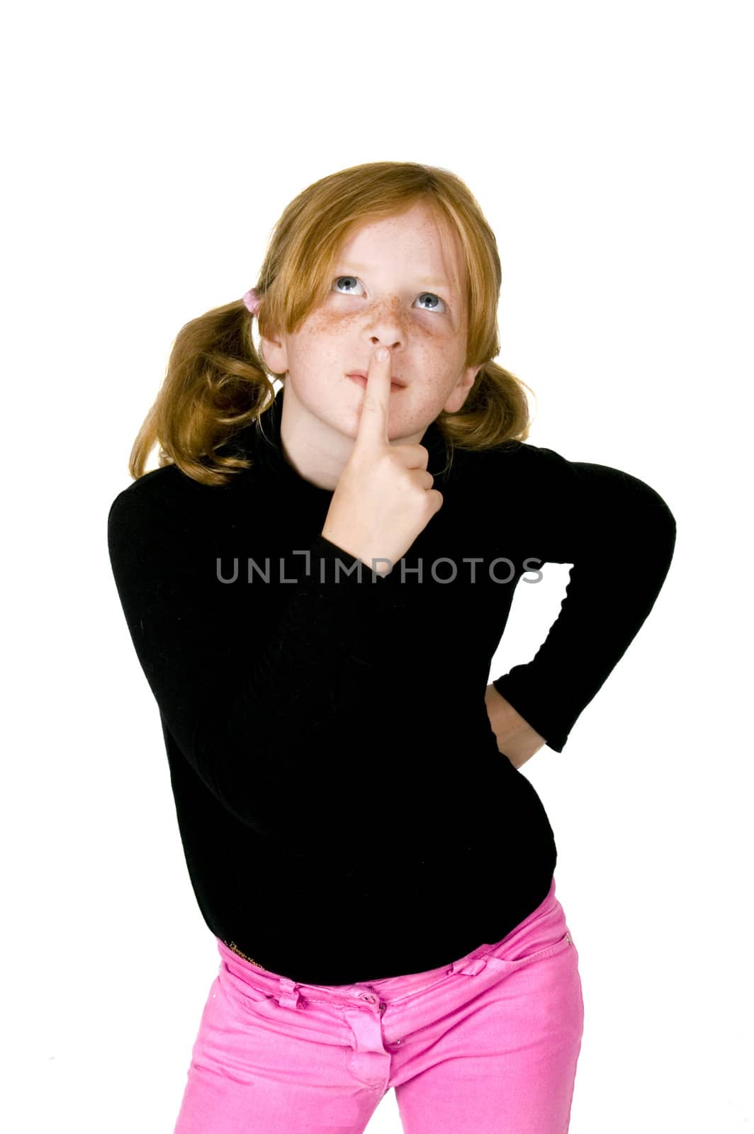 little girl is thinking putting her finger to her lips