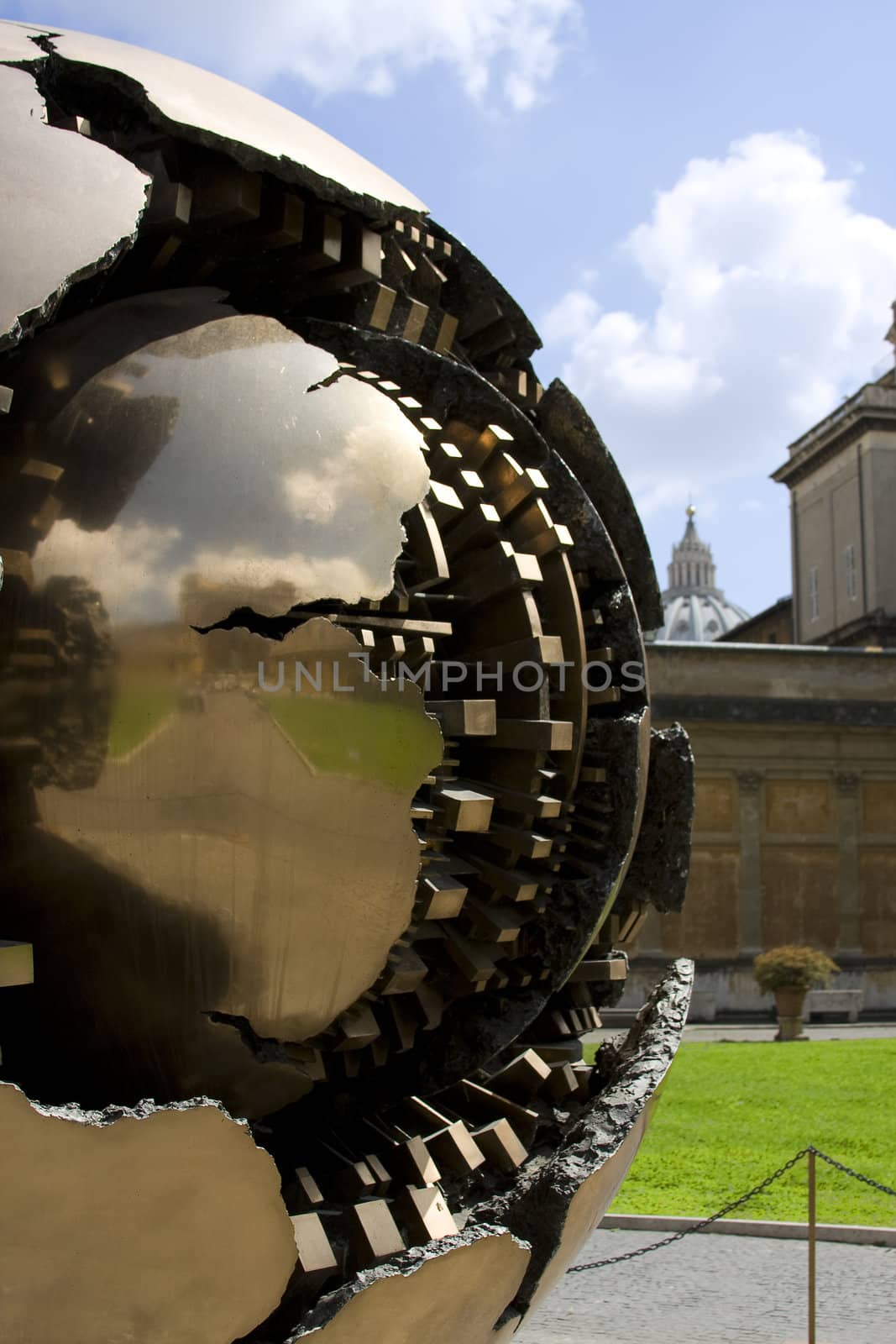 Sphere in sphere in Vatican with green grass