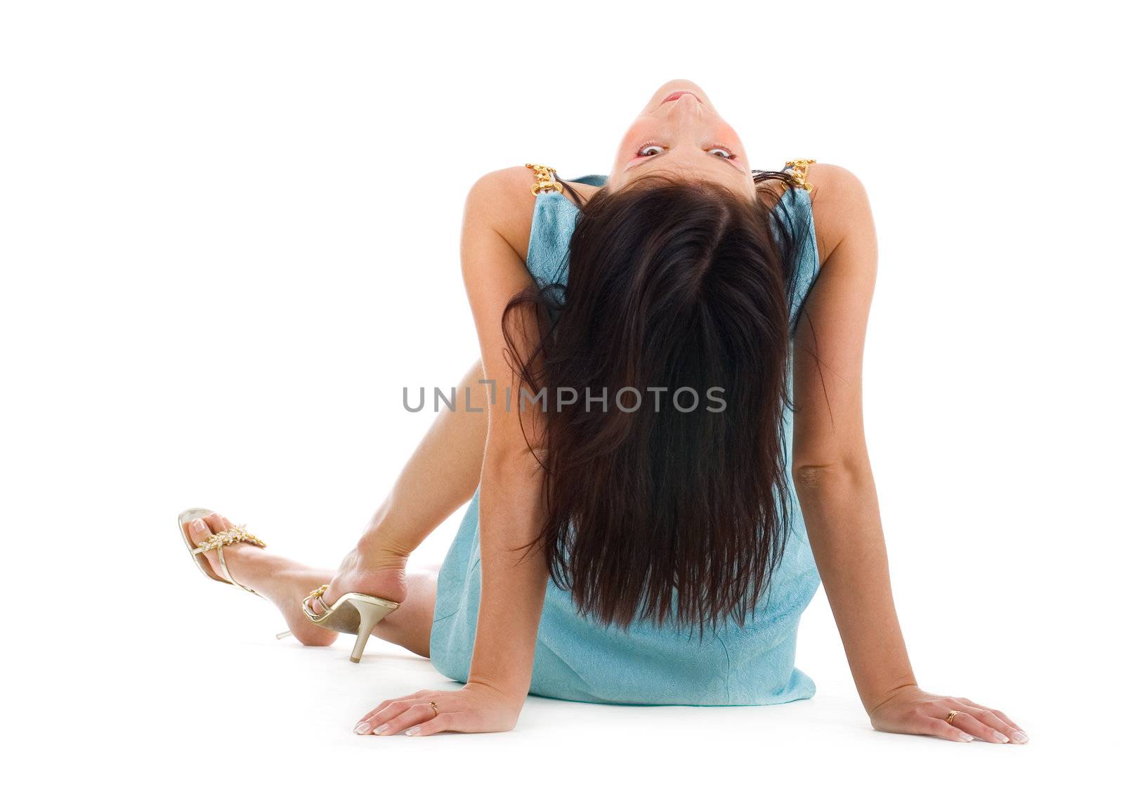 Beautiful young white woman sitting on a floor