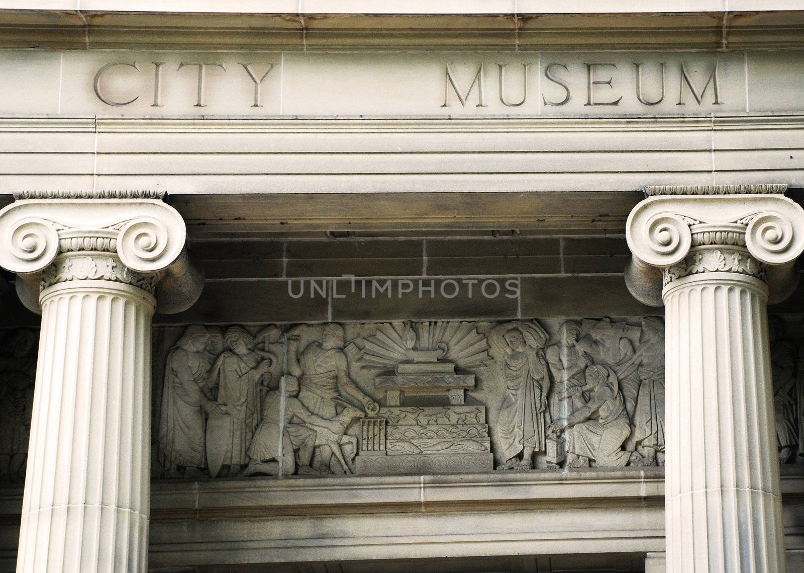 A photograph of intricately carved stonework of a City Museum in Sheffield, in the north of England