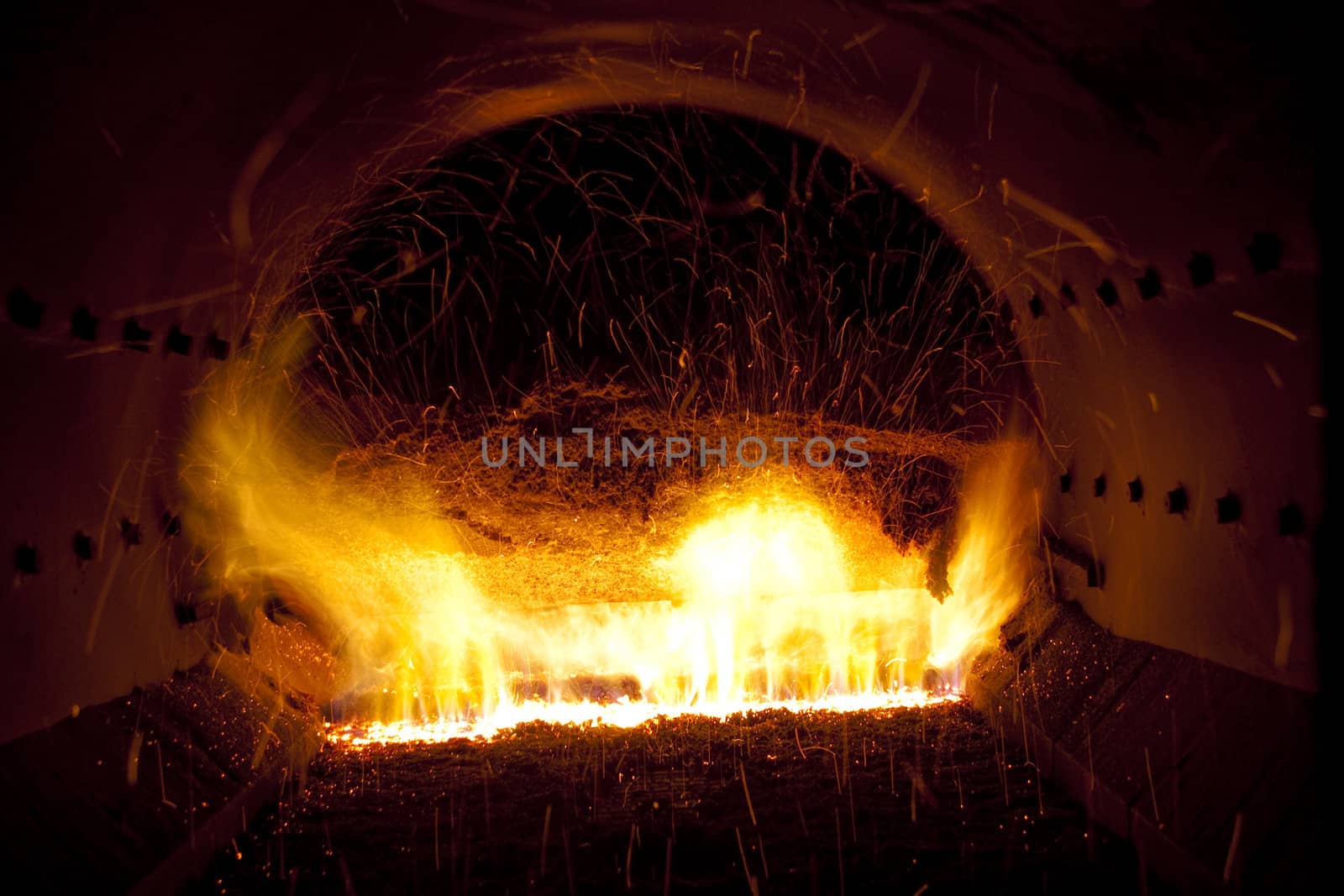 Close up colorful fire in industrial furnace - Polish power station.