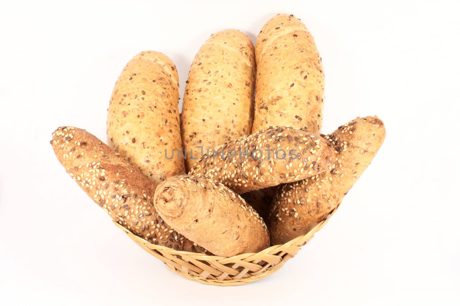 Basket full of pastries isolated on white