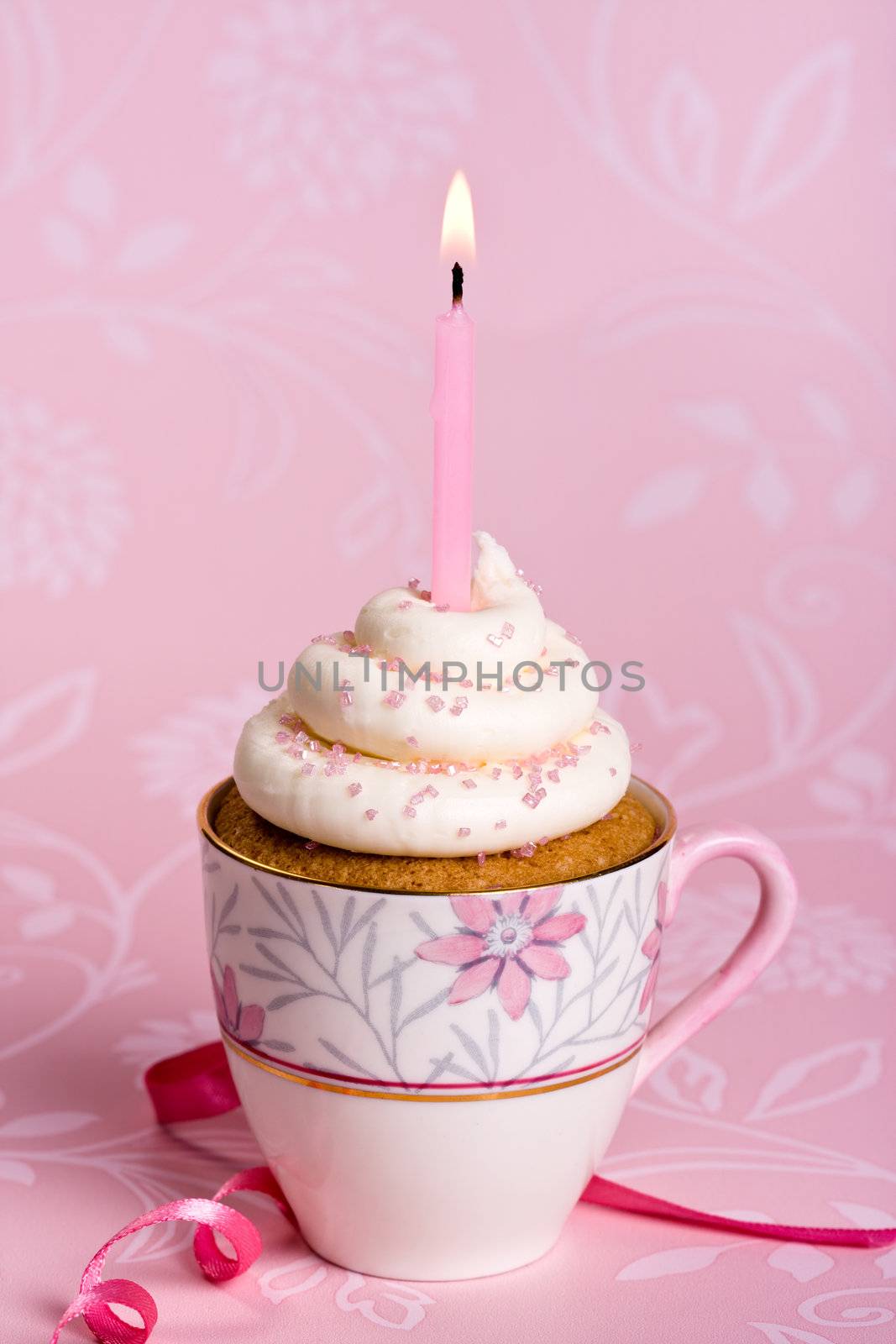 Pink birthday cupcake in a teacup