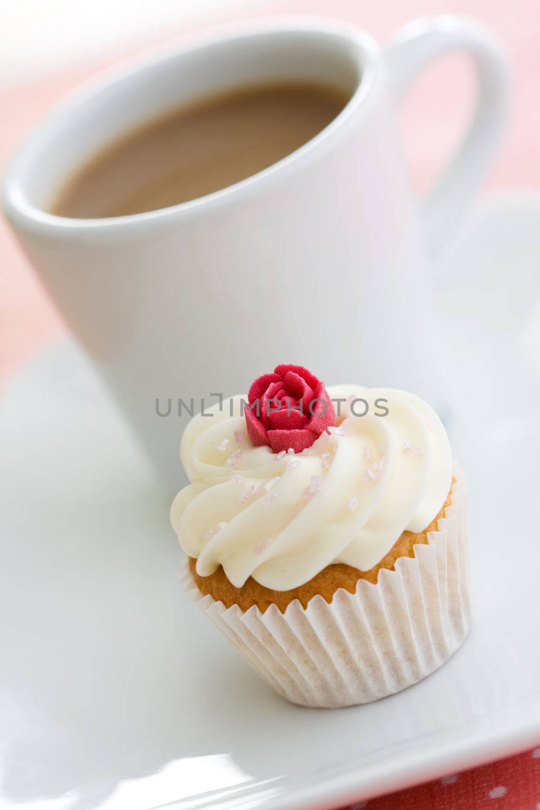 Coffee and cupcake on a white plate