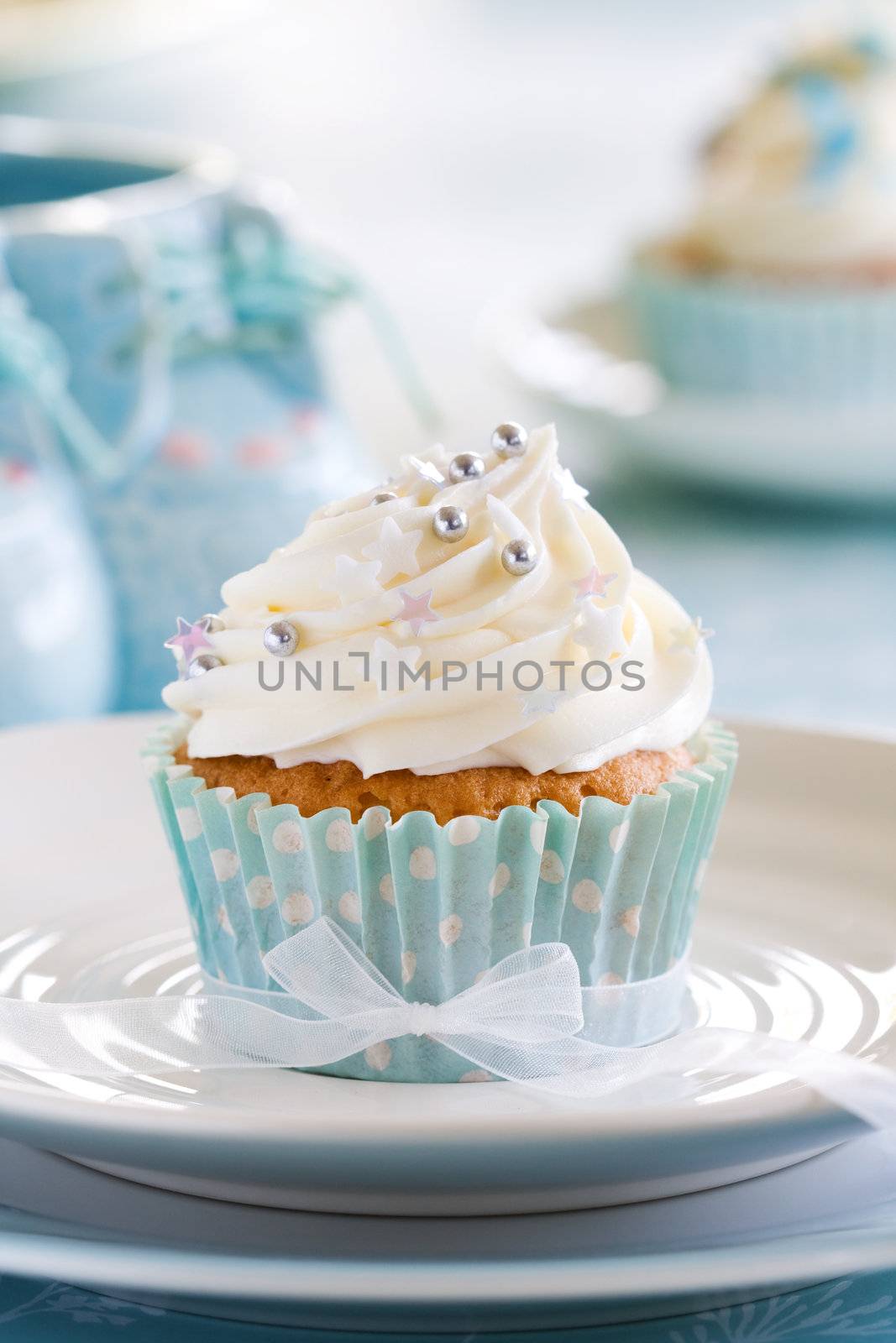 Blue and white cupcake decorated for a baby shower